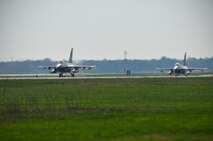 Two U.S. Air Force F-16C Fighting Falcons piloted by Lt. Col. John Bratun and Maj. Ernest Bio taxi for takeoff at Atlantic City International Airport on April 8th, 2010.  Colonel Bratun and Major Bio are assigned to the 119th Fighter Squadron.  (U.S. Air Force photo/Staff Sgt. Matt Hecht) 