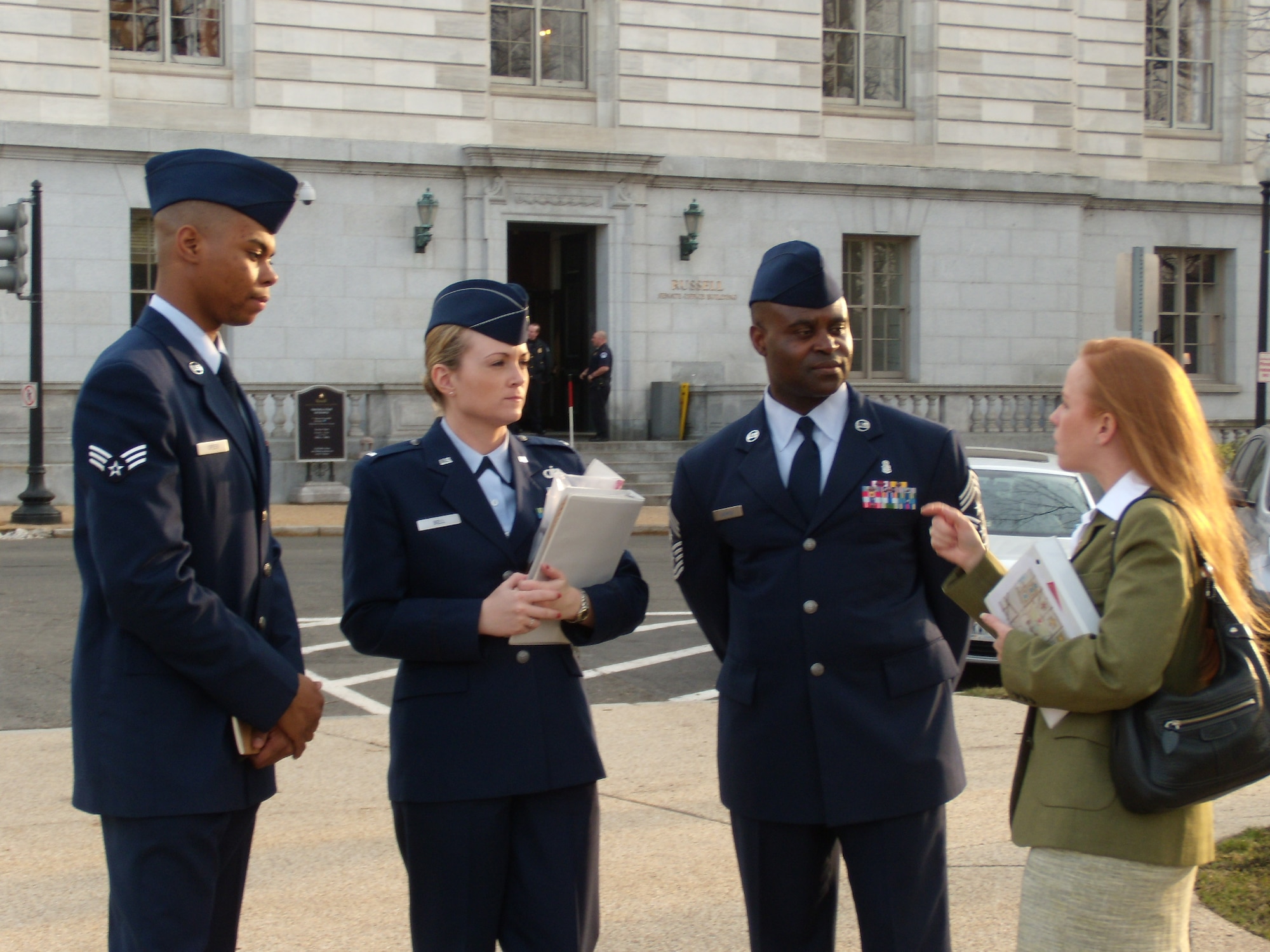 From left: Senior Airman Quinton Green, 72nd Medical Support Squadron; 1st Lt. Christina Bell, 72nd Operations Support Squadron, and 72nd Air Base Wing and installation Command Chief Master Sgt. Eric Harmon, speak with a legislative liaison during the wing’s annual trip to Washington, D.C. (Air Force photo)