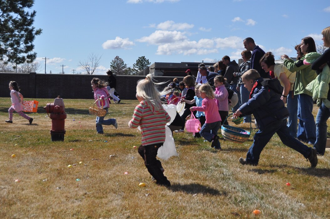 Children of Utah Air National Guard members race to find Easter eggs during the ANG's annual Children's Easter Egg Hunt March 27. Hundreds of Air Guard children attended the event, which included a magic show, egg hunt and hot dog lunch.  U.S. Air Force photo by Lindsey Cheetham.