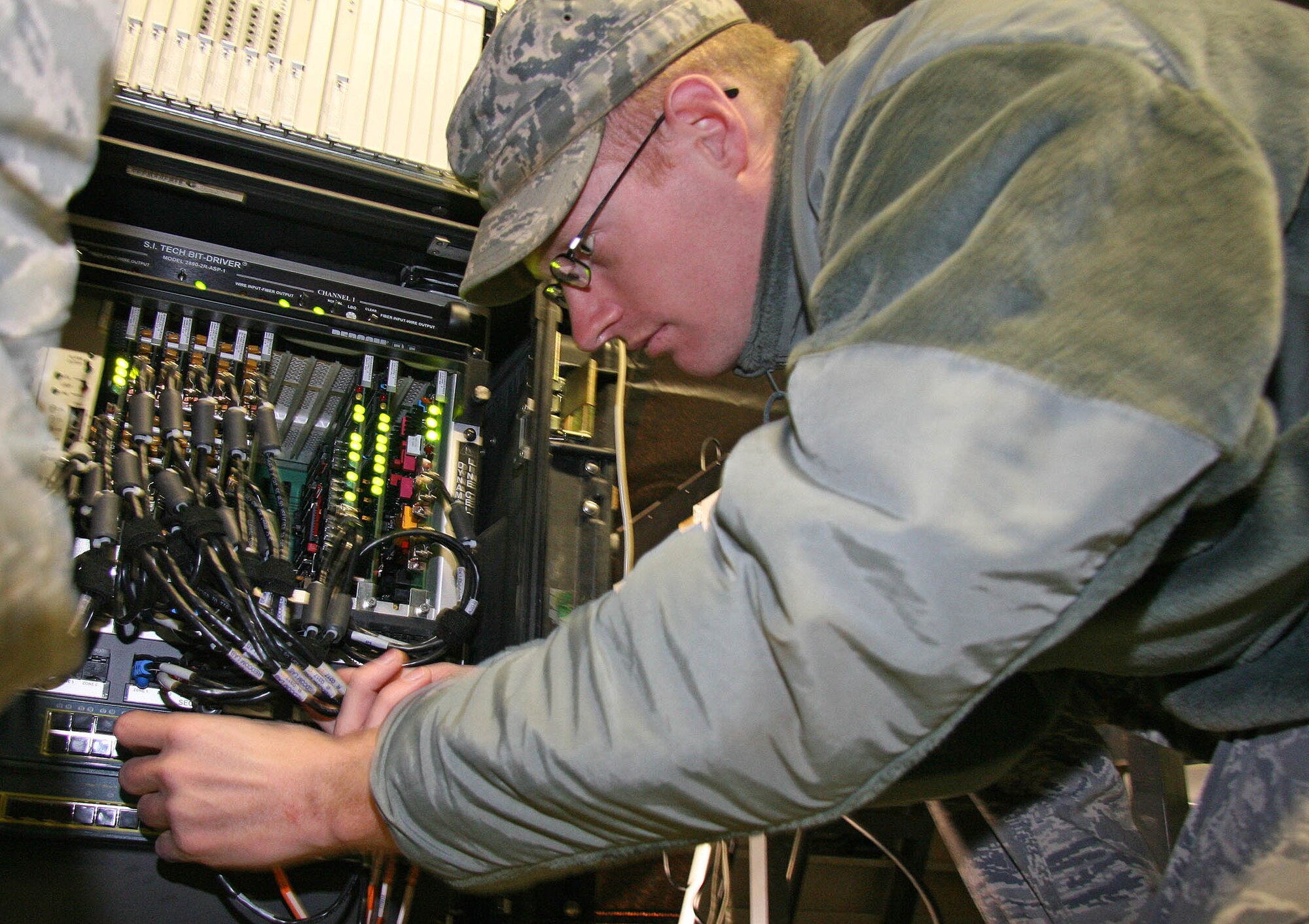 Senior Airman Brandon Thompson sets up bare base communications equipment March 18 during a training mission. The Airmen with the 3rd Combat Communications Group will compete with 16 fellow 3rd Herders in the upcoming Guardian Challenge, which will be held at Tinker April 16-19.