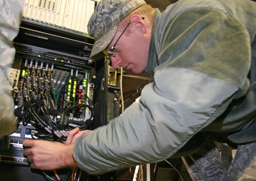 Senior Airman Brandon Thompson sets up bare base communications equipment March 18 during a training mission. The Airmen with the 3rd Combat Communications Group will compete with 16 fellow 3rd Herders in the upcoming Guardian Challenge, which will be held at Tinker April 16-19.