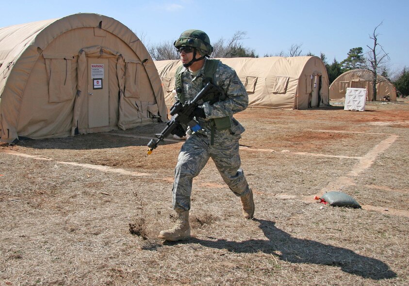 Airman 1st Class Teverence Davis moves to a forward position while taking enemy fire during an exercise at the Glenwood Training Area.