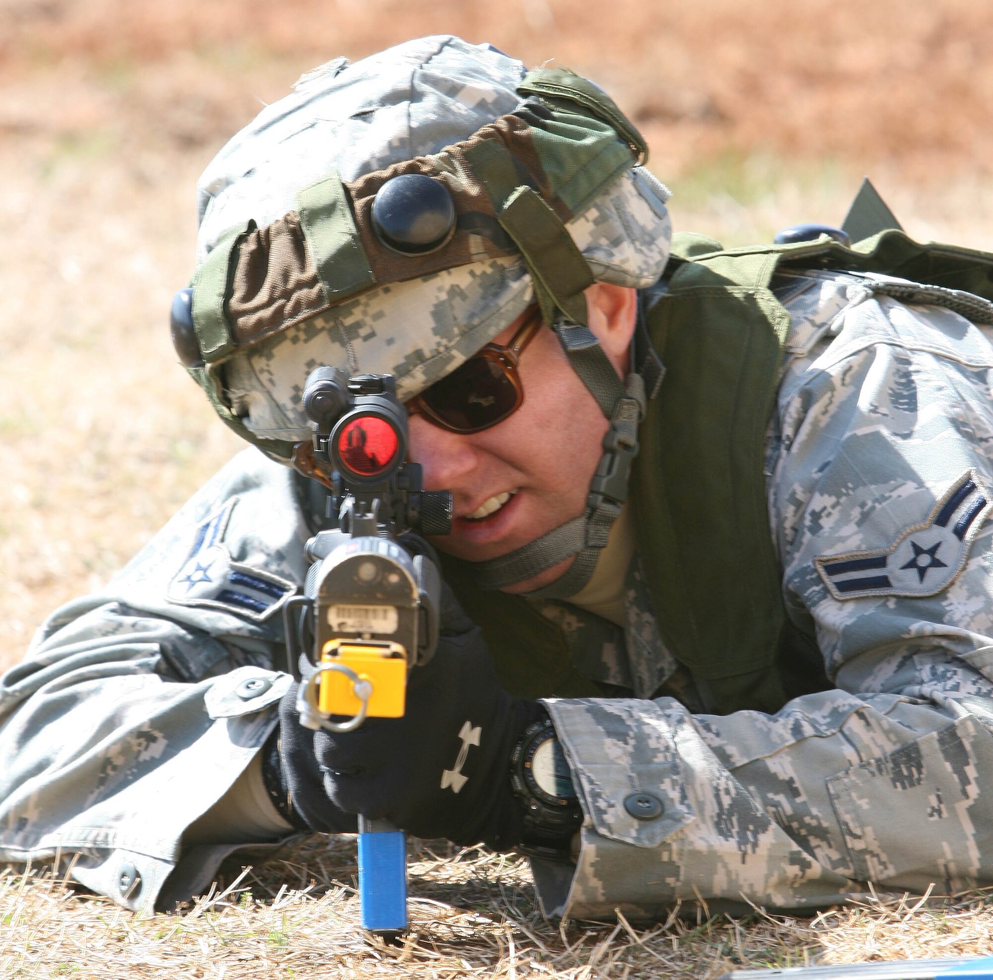 Airman 1st Class Benjamin Fleming peers through the sight scope on his M-4 March 17 during an exercise at Glenwood.