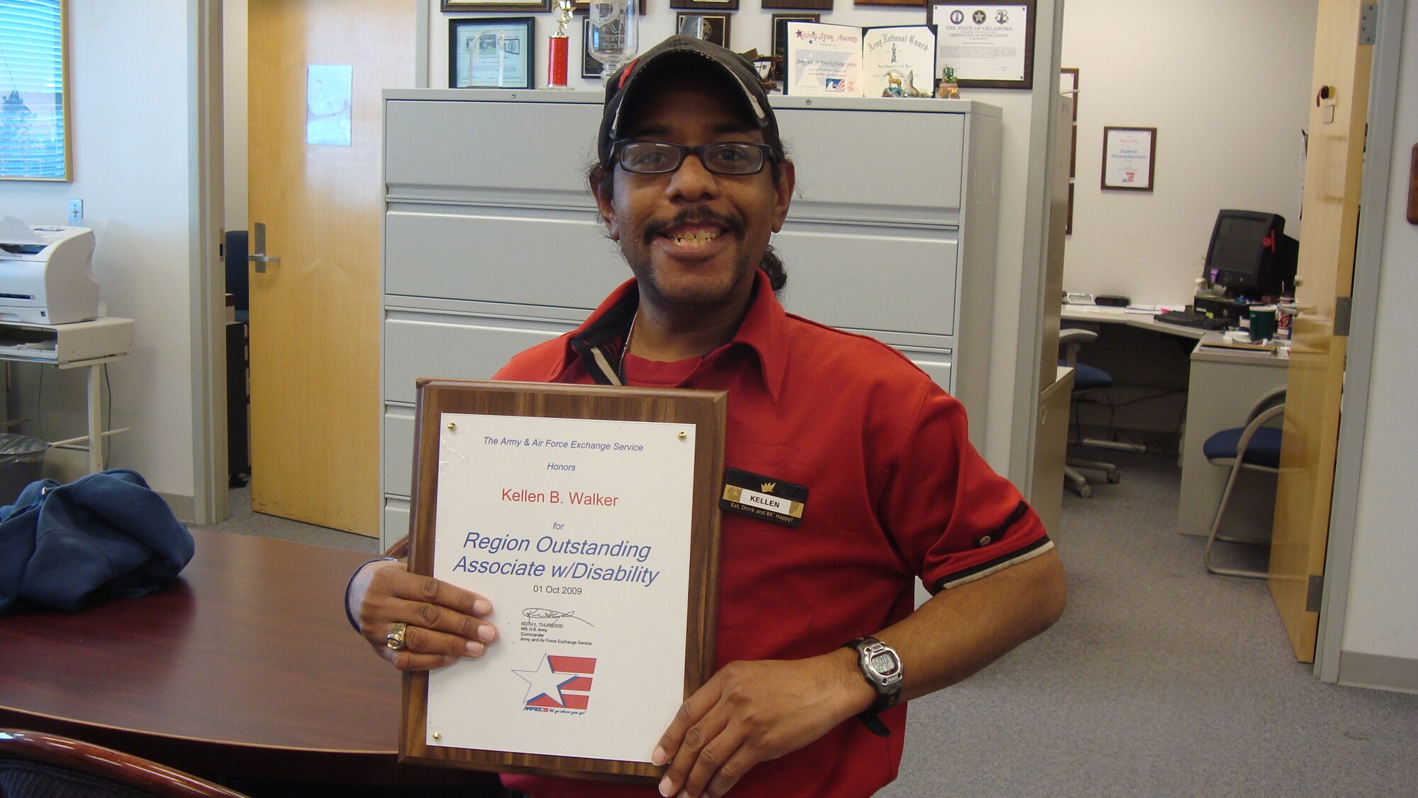 Tinker worker named AAFES Central Region Outstanding Employee with Disability
Kellen Walker was recently named the Army and Air Force Exchange Service’s Outstanding Associate with Disability in the Central Region and came in second worldwide. Kellen has been a food service worker at Burger King since Oct. 27, 2003. His job is to keep the dining room clean and ready for customers. Despite having a disability, Kellen delivers world-class customer service everyday with a big smile and a friendly word. He is the son of retired Air Force Maj. Michael Walker and Brenda Walker. (Courtesy photo)
