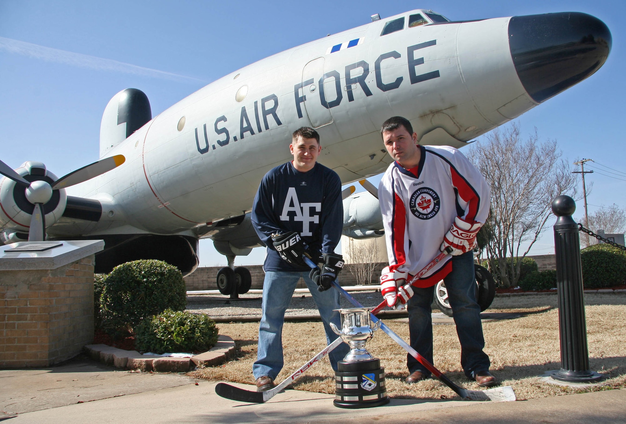 This month will mark the second time for the 552nd ACW Canadian Detachment to meet their American 552nd counterparts on the ice. American team captain Jim Behn, left, and Canadian team captain James McCarrron will lead the head to head hockey clash for the second annual 552nd ACW Can-Am Cup. (Air Force photo by John Stuart)