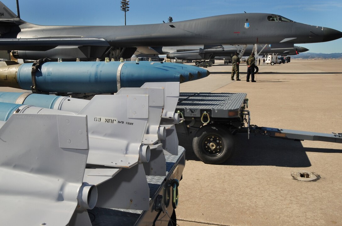 ELLSWORTH AIR FORCE BASE, S.D. -- Munitions and B-1B Lancers are lined up on the flightline preparing for missions, April 8.  Carrying the largest payload of both guided and unguided weapons in the Air Force inventory, the multi-mission B-1 is the backbone of America's long-range bomber force. (U.S. Air Force photo/Airman 1st Class Anthony Sanchelli)
