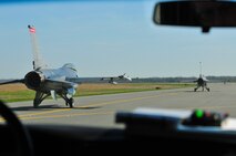 Two U.S. Air Force F-16C Fighting Falcons piloted by Lt. Col. John DiDonna and Maj. Ernest Bio taxi towards the runway at Atlantic City International Airport on April 7th, 2010.  Colonel DiDonna is the 177th Operations Group Commander, and Major Bio is assigned to the 119th Fighter Squadron.  (U.S. Air Force photo/Staff Sgt. Matt Hecht) 