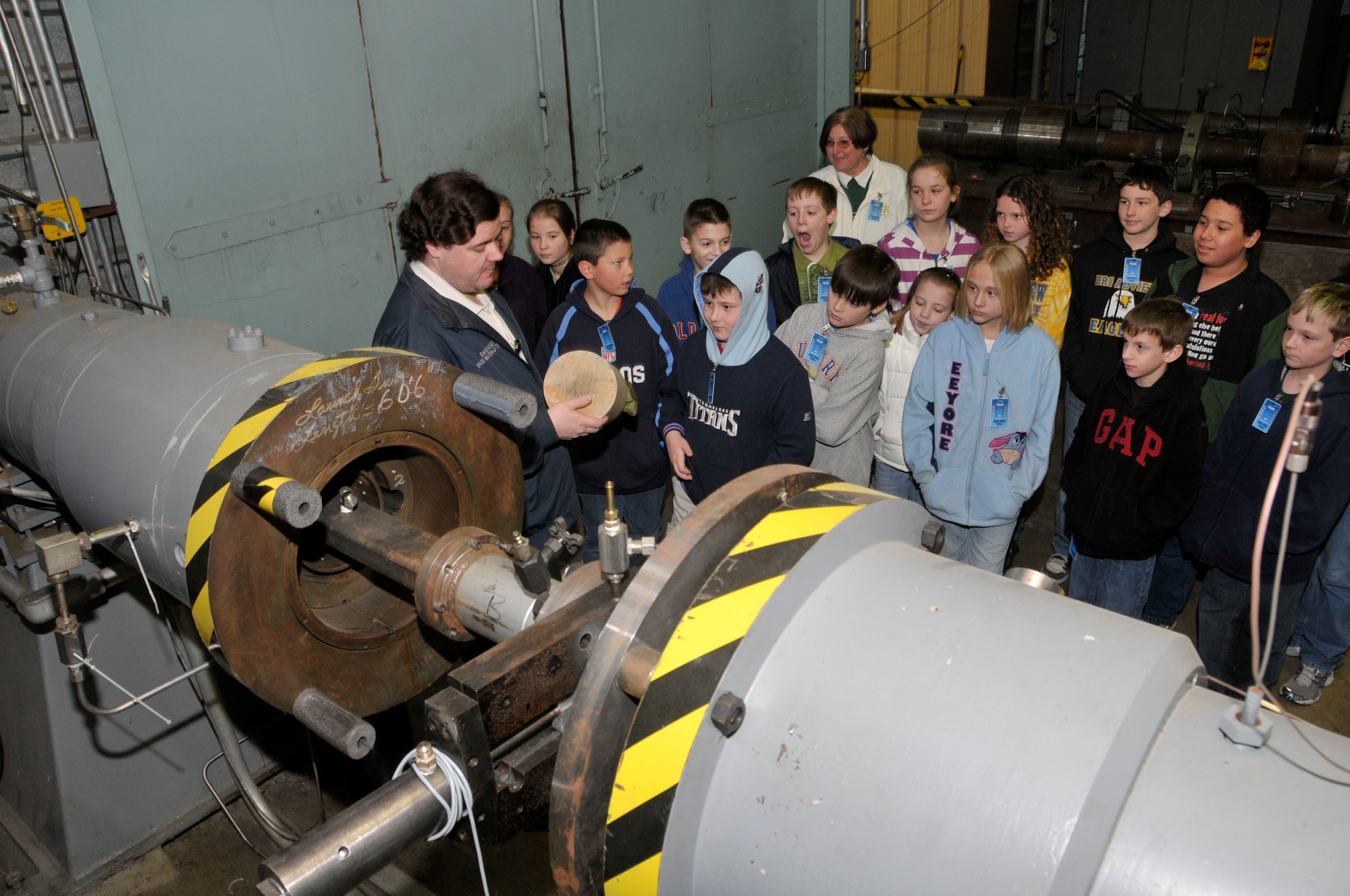 Fifth grade enrichment students from Cowan and Broadview elementary schools in Franklin County listen to David Woods, Aerospace Testing Alliance project engineer, explained the process for the bird impact testing at one of the center’s ballistic ranges. (Photo by Rick Goodfriend)