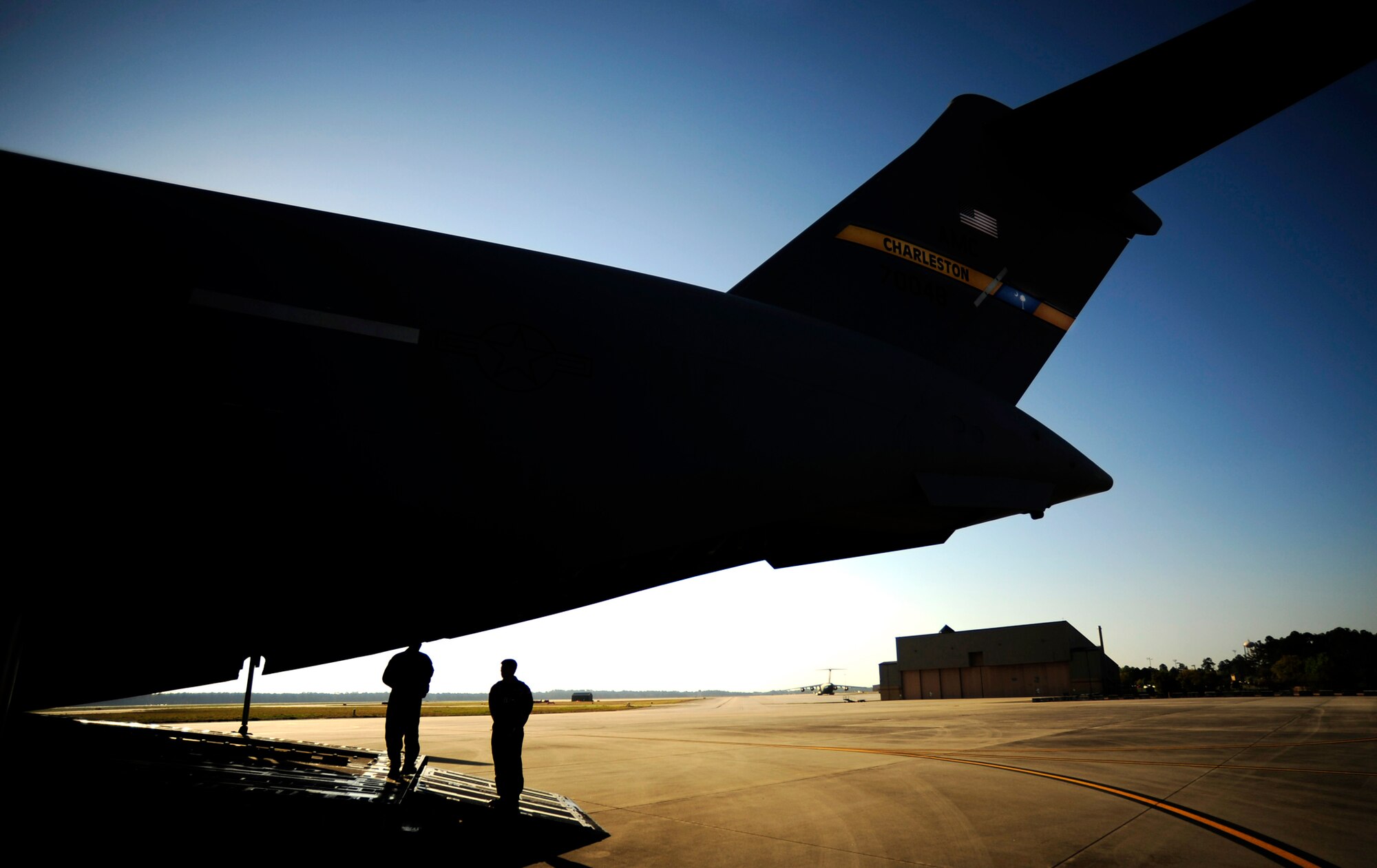 Loadmasters perform pre-flight inspections on a C-17 Globemaster III during a local training mission over North Field near Charleston Air Force Base, S.C., April 5, 2010.  The loadmasters are assigned to the 317th Air Reserve Squadron. (U.S. Air Force photo/Staff Sgt. Andy M. Kin)