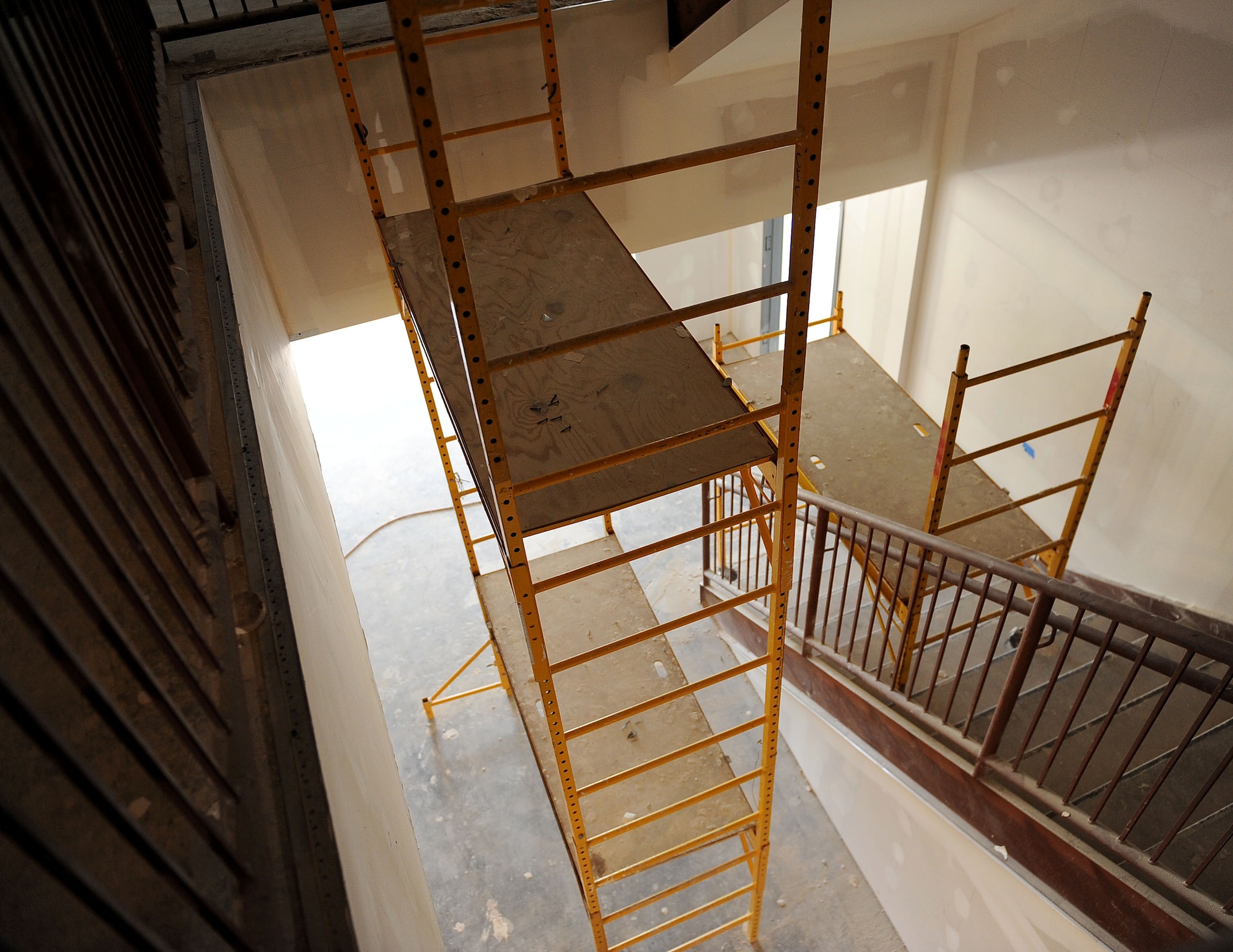 LANGLEY AIR FORCE BASE, Va. -- A staircase in the middle of restoration is shown at the construction site of the Air Combat Command Directorate A4 building during the Base Civil Engineer Update Project Tour March 7. 633 CES is constructing and improving multiple facilities base-wide. (U.S. Air Force photo/Airman Rebecca Montez)