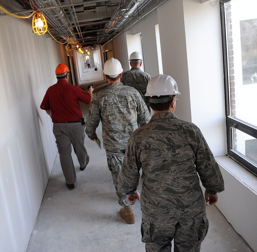 LANGLEY AIR FORCE BASE, Va. -- John Schmied, civil engineer contractor, gives Col. Donald Kirkland, 633d Air Base Wing commander, and Lt. Col. Jeffery Ullmann, 633d Civil Engineer Squadron commander, a tour of restored office space at the construction site of the Air Combat Command Directorate A4 building during the Base Civil Engineer Update Project Tour March 7. 633 CES is constructing and improving multiple facilities base-wide. (U.S. Air Force photo/Airman Rebecca Montez)