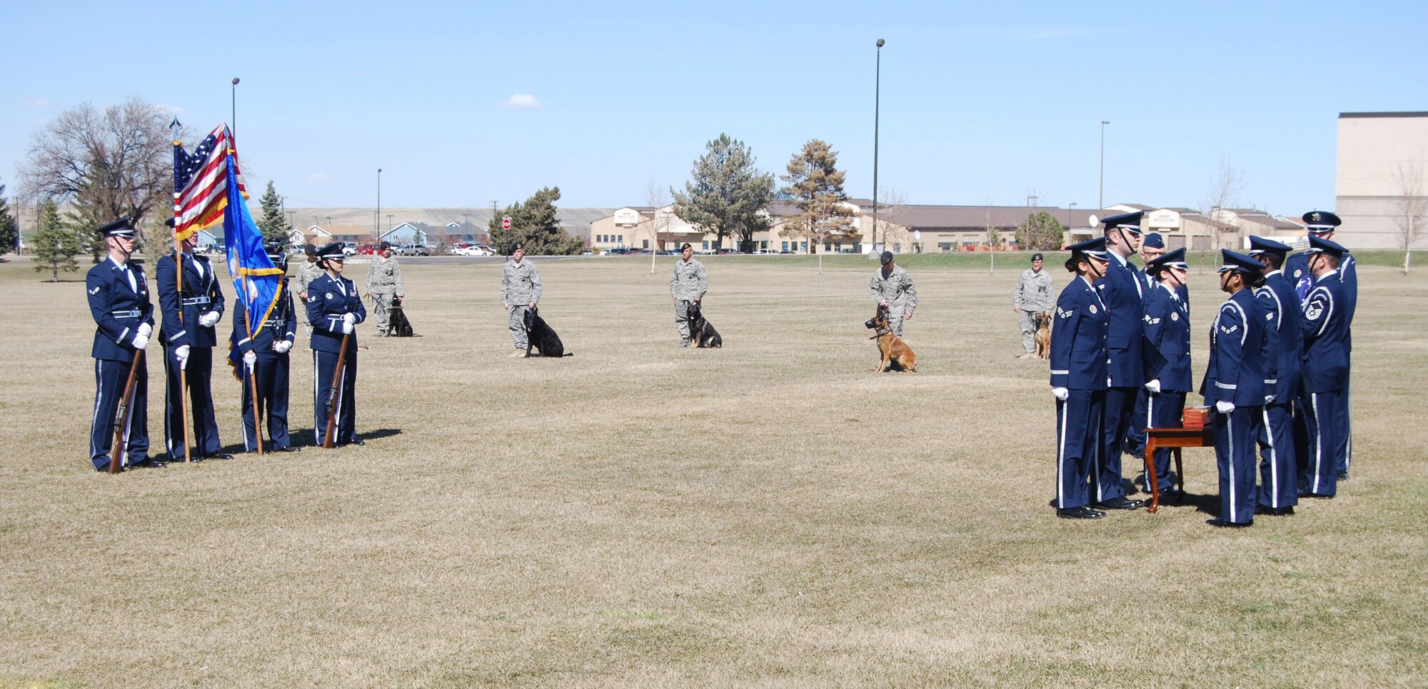 Fellow military working dog handlers, and their K-9 accomplices, came to the memorial service of MWD Kajo to pay their last respects April 2. The ceremony took place outside the Grizzly Bend Club. (U.S. Air Force photo/Airman 1st Class Kristina Overton)