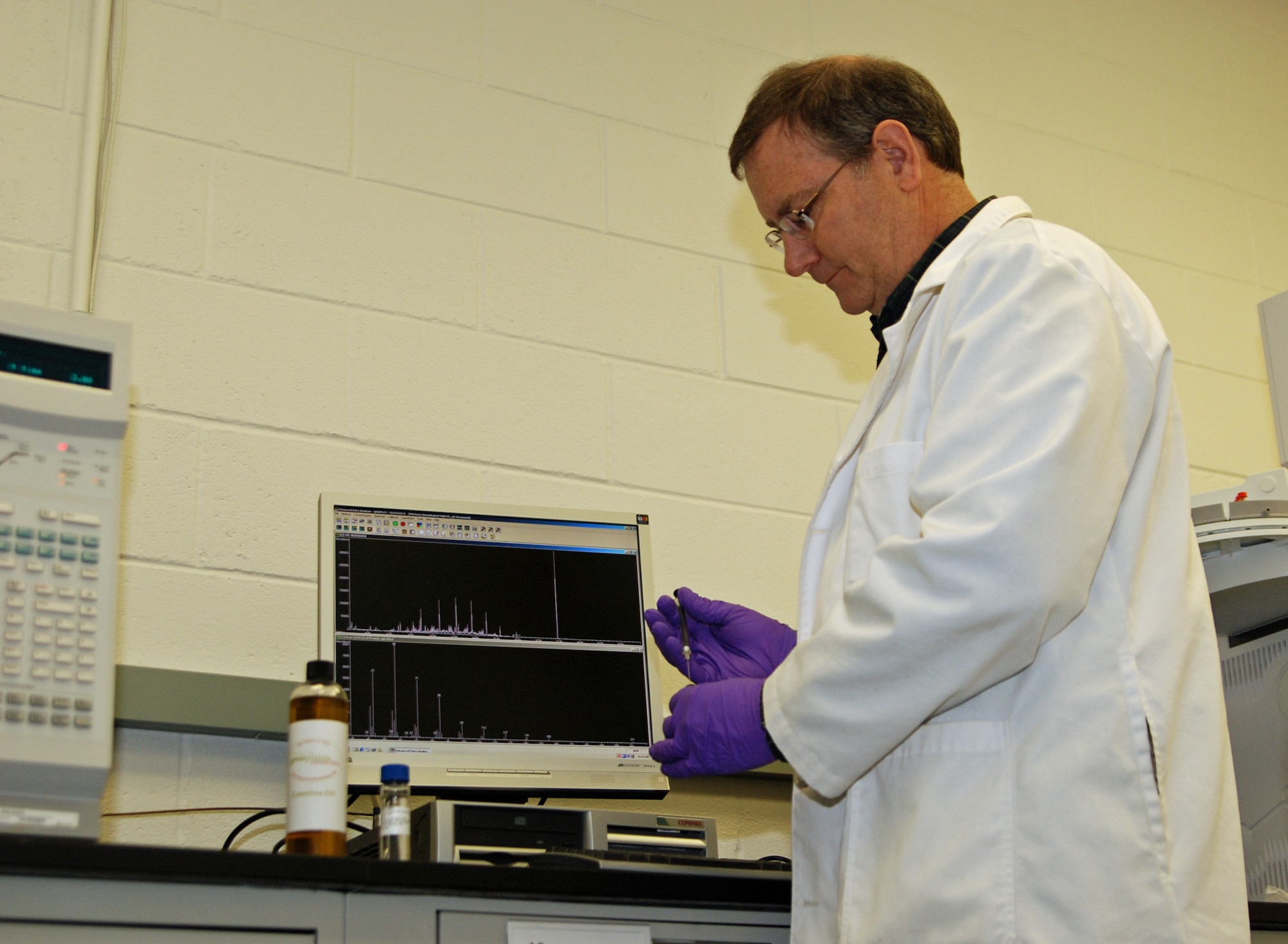 Richard Strievich, with the University of Dayton Research Institute, runs laboratory tests on camelina oil at the Air Force Research Laboratory, Wright-Patterson Air Force Base, Ohio. AFRL is working closely with a number of industry and academic partners to research and develop hydro-treated renewable jet (HRJ) derived from plant oils and animal fats.  Air Force Alternative Fuels Certification Office officials intend to certify a 50-50 blend of  HRJ with traditional JP-8 jet fuel to power the service's entire fleet of aircraft.  (U.S. Air Force photo/Bonnie White)