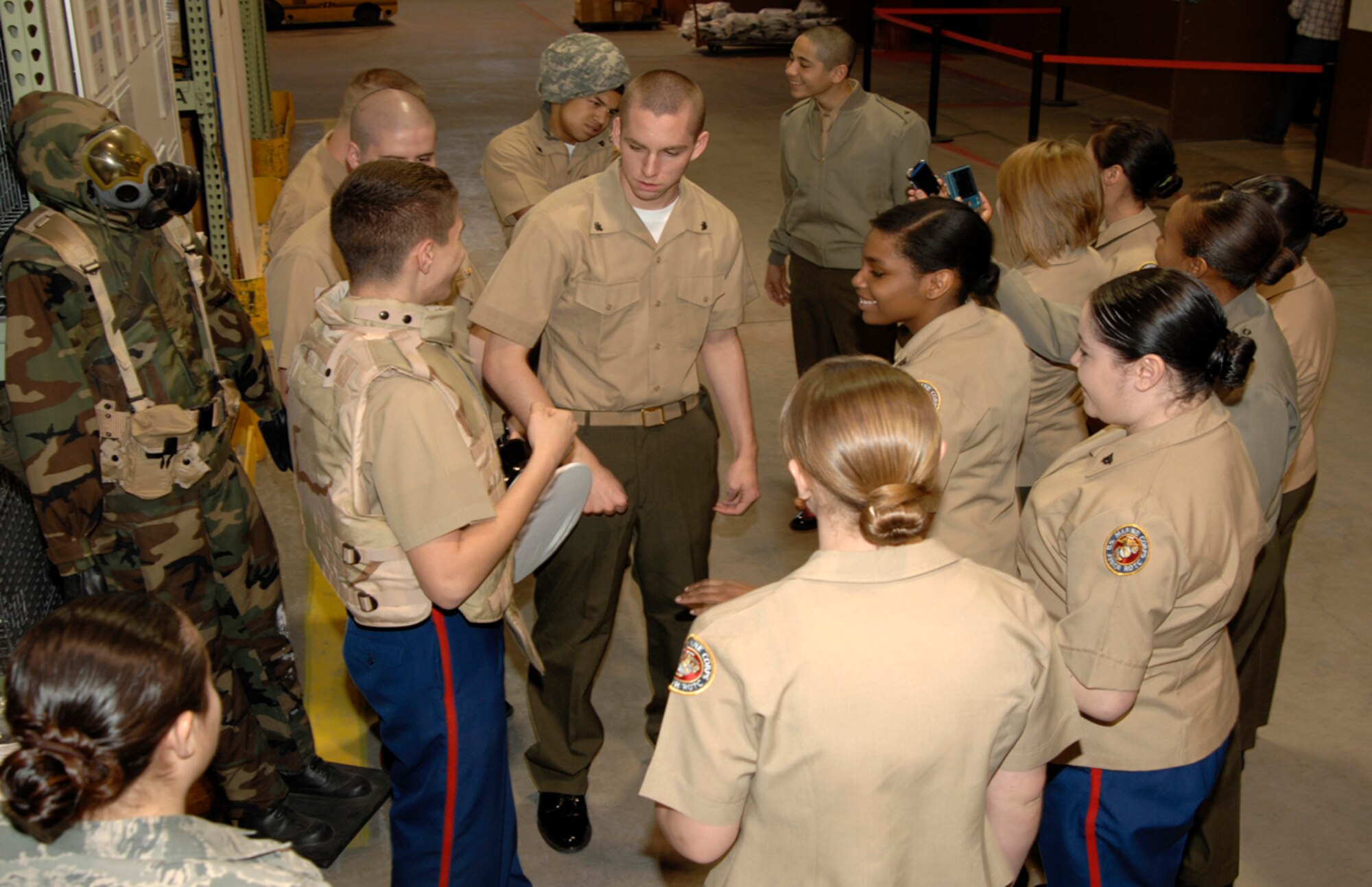 Marine Junior Reserve Officers’ Training Corps cadets from Northeast Magnet High School, tour the 22nd Logistics Readiness Squadron’s individual protective equipment warehouse, April 7, 2010, McConnell Air Force Base, Kan. The cadets toured the warehouse, donned IPE and viewed weapons in the 22nd LRS armory. (U.S. Air Force photo/Airman 1st Class Justin Shelton)
