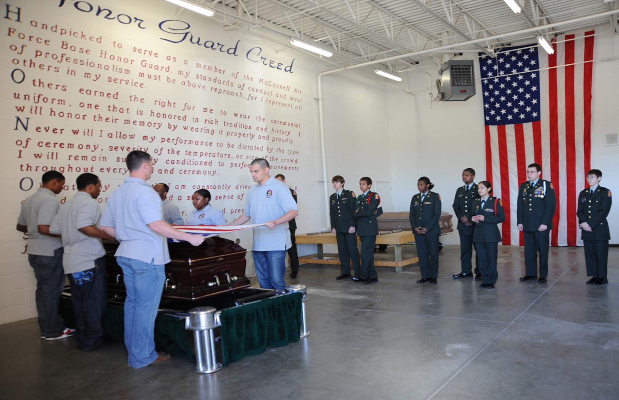 Airmen from McConnell’s Honor Guard demonstrate procedures for a funeral with military honors for Army Junior Reserve Officers’ Training Corps cadets from Wichita public high schools, April 7, 2010, McConnell AFB, Kan. Airmen representing a variety of career fields around base educated the 56 cadets on different aspects of McConnell's role within the Air Force mission. The base maintains the world’s largest KC-135 Stratotanker fleet, supporting Air Mobility Command aerial refueling, airlift and aeromedical evacuation missions worldwide. (U.S. Air Force photo/Airman 1st Class Andrea Salazar)