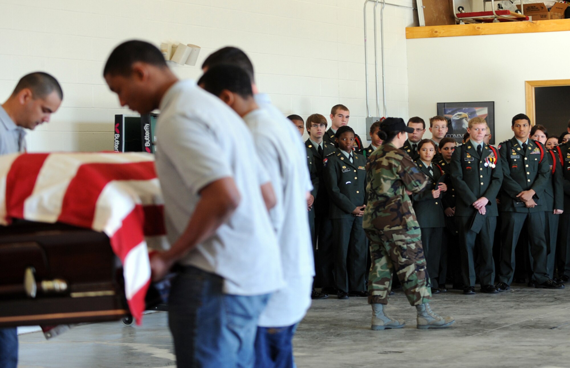 Staff Sgt. Kelly Duff, McConnell’s Honor Guard NCOIC, explains the Honor Guard’s procedures for a funeral with military honors to Army Junior Reserve Officers’ Training Corps cadets from Wichita public high schools, April 7, 2010, McConnell AFB, Kan. The 56 JROTC cadets toured McConnell to experience day-to-day Air Force operations. (U.S. Air Force photo/Airman 1st Class Andrea Salazar)