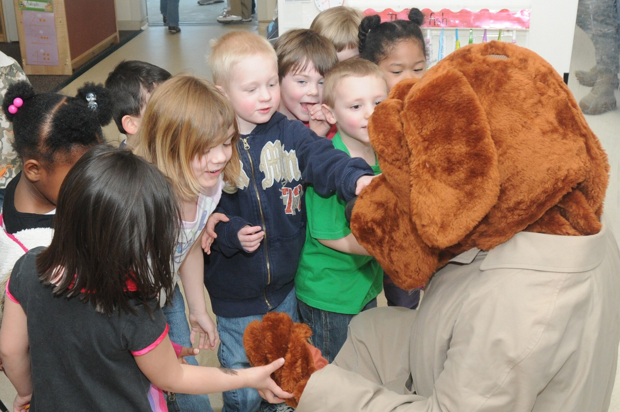 McGruff the Crime Dog greets the 3 to 5 year-old class of the Child Development Center April 8. McGruff the Crime Dog visited the CDC as a part of the Month of the Military Child. (U.S. Air Force photo/Airman LaVel Sterling)