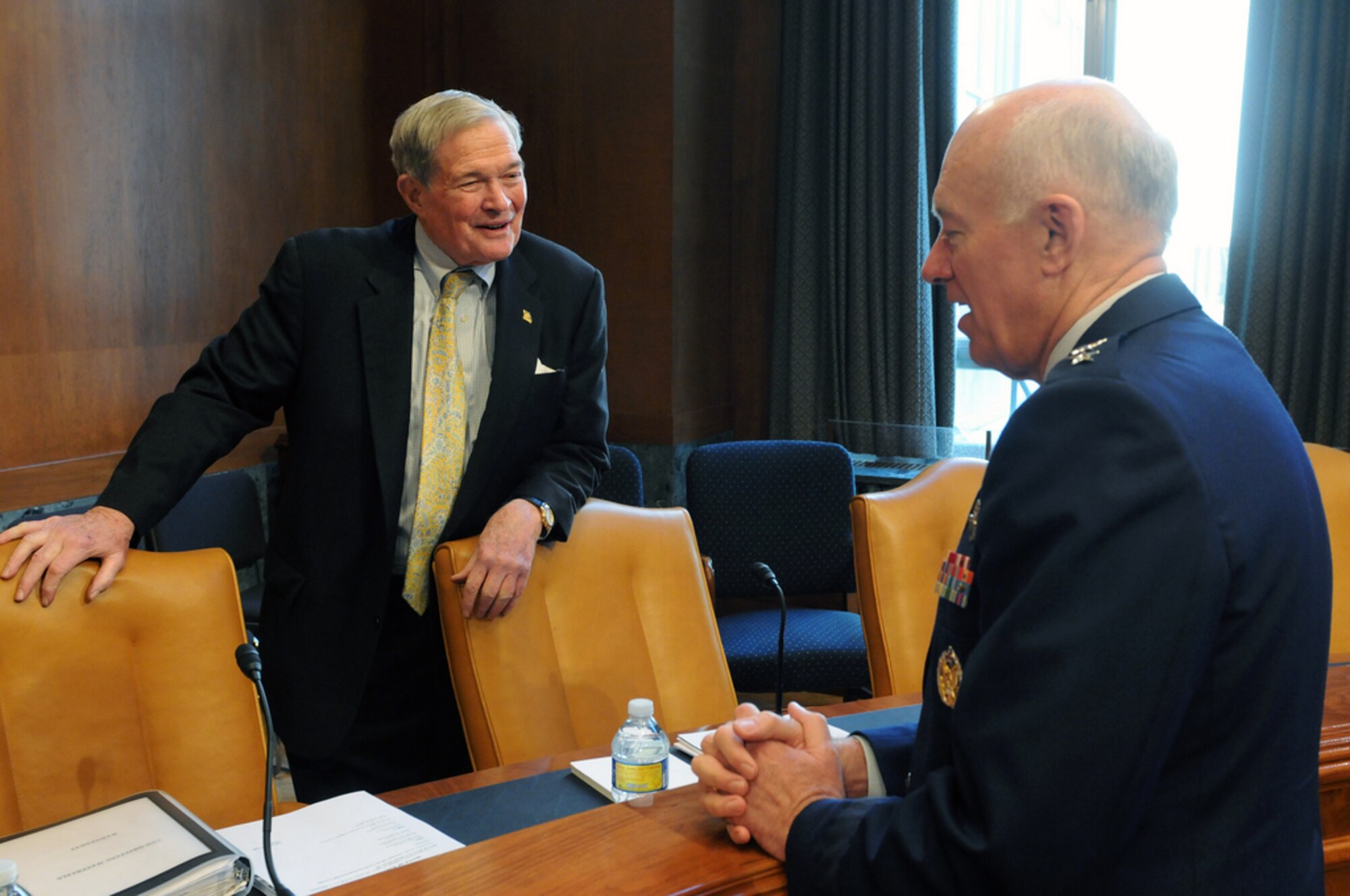 U.S. Sen. Christopher "Kit" Bond talks with Air Force Lt. Gen. Harry M. Wyatt III,  director of the Air National Guard, before a hearing of the Senate Appropriations Subcommittee on Defense in Washington, D.C., March 24, 2010. (U.S. Army photo by Staff Sgt. Jim Greenhill) (Released) Classification: UNCLASSIFIED Caveats: FOUO
