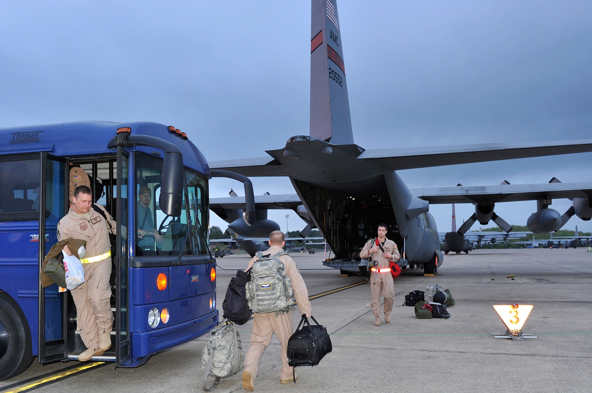 (Left to right) Maj. Joshua Peterson and 1st Lt. Nathan Hering, 50th Airlift Squadron, prepare to fly out of Little Rock Air Force Base April 7. The 50th AS members are deployed in support of Operation Iraqi Freedom. (U.S. Air Force photo by Senior Airman Christine Clark)