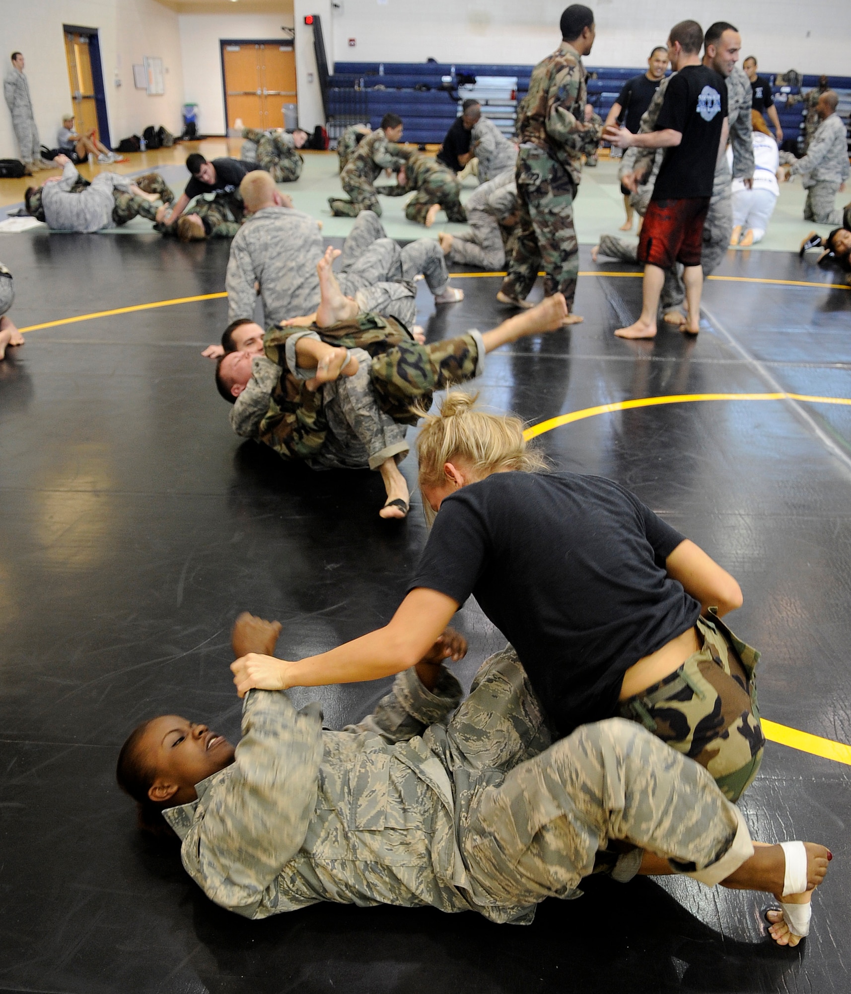 LANGLEY AIR FORCE BASE, Va.-Team Langley members practice combative maneuvers during Modern Combatives training April 7. For the first time, Langley and Fort Eustis Service members merged in a session of combatives, which is the Army's version of hand-to-hand combat training. (U.S. Air Force photo/Senior Airman Dana Hill)