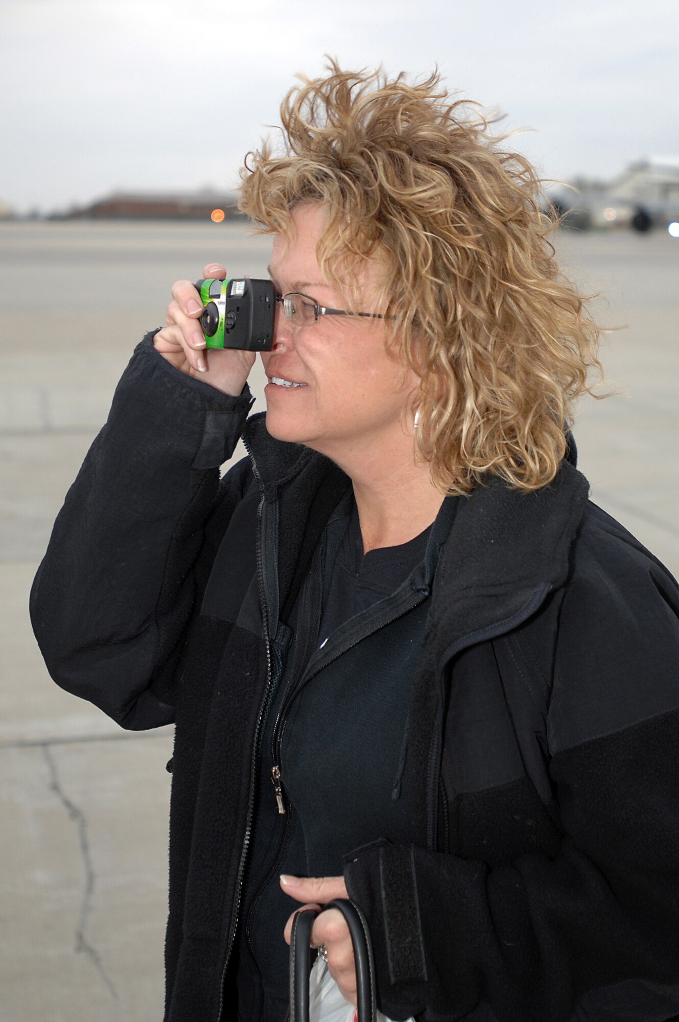 GRISSOM AIR RESERVE BASE, Ind. -- Jeanne Woods-Huffman snaps a photo of a KC-135R Stratotanker she is about to board during a recent employer orientation flight. Employers of 434th Air Refueling Wing personnel visited the base and received a first-hand look at the 434th Air Refueling Wing, including an aerial refueling mission.  (U.S. Air Force photo/Tech. Sgt. Mark R. W. Orders-Woempner)