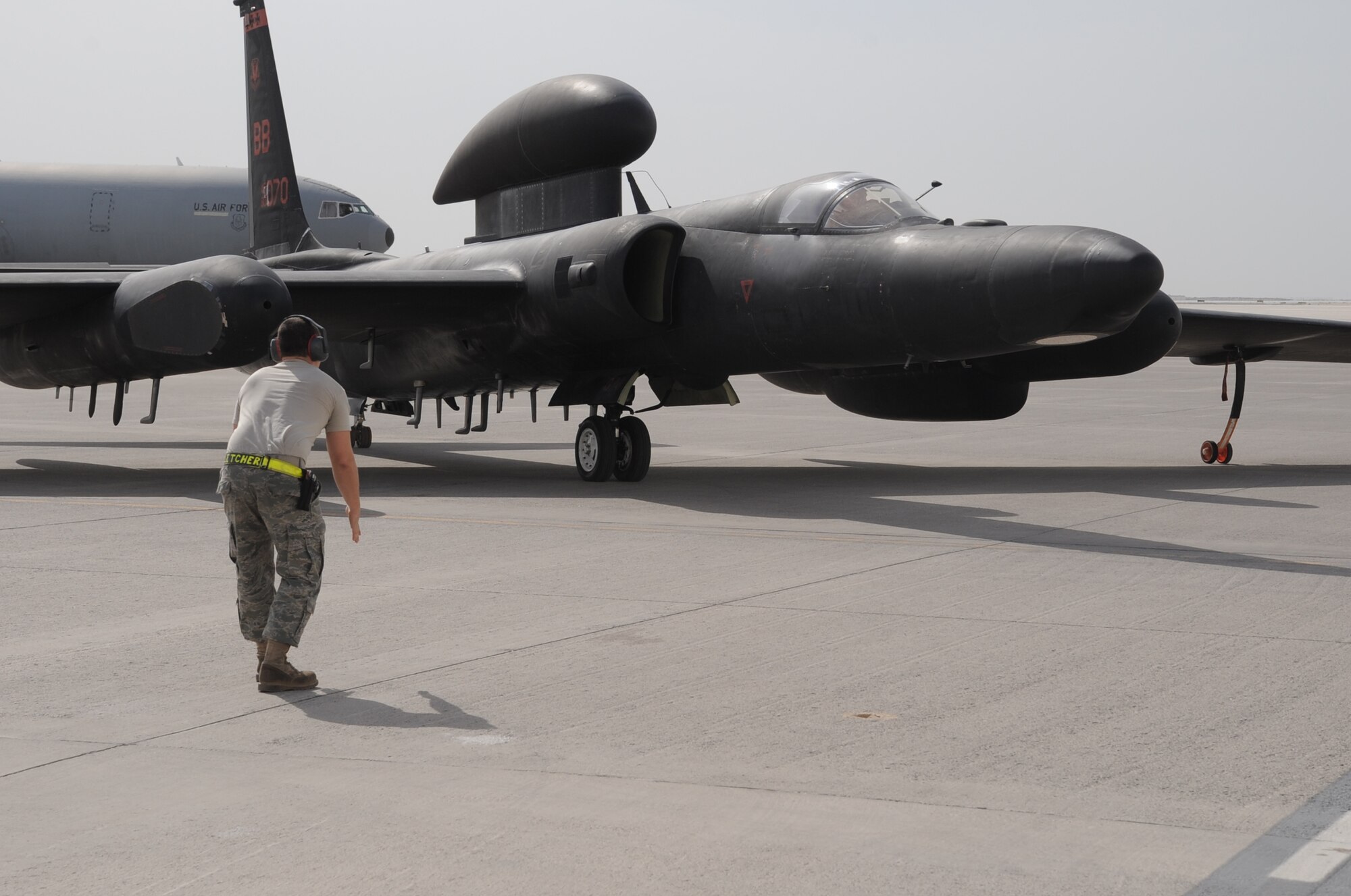 A maintenance Airman from the 380th Expeditionary Aircraft Maintenance Squadron Dragon aircraft maintenance unit guides a pilot from the 99th Expeditionary Reconnaissance Squadron in a U-2 Dragon Lady to a parking space at non-disclosed base in Southwest Asia after completing a combat mission in the U.S. Central Command area of responsibility April 5, 2010. The U-2 is deployed from Beale Air Force Base, Calif. The 99th ERS, as part of the 380th Air Expeditionary Wing, supports operations Iraqi Freedom and Enduring Freedom and the Combined Joint Task Force-Horn of Africa. (U.S. Air Force Photo/Master Sgt. Scott T. Sturkol/Released)