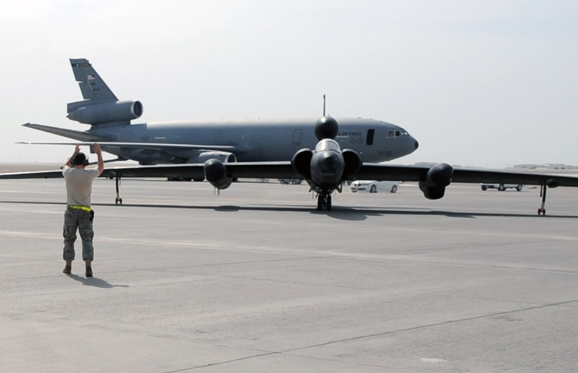 A maintenance Airman from the 380th Expeditionary Aircraft Maintenance Squadron Dragon aircraft maintenance unit guides a pilot from the 99th Expeditionary Reconnaissance Squadron in a U-2 Dragon Lady to a parking space at non-disclosed base in Southwest Asia after completing a combat mission in the U.S. Central Command area of responsibility April 5, 2010. The U-2 is deployed from Beale Air Force Base, Calif. The 99th ERS, as part of the 380th Air Expeditionary Wing, supports operations Iraqi Freedom and Enduring Freedom and the Combined Joint Task Force-Horn of Africa. (U.S. Air Force Photo/Master Sgt. Scott T. Sturkol/Released)