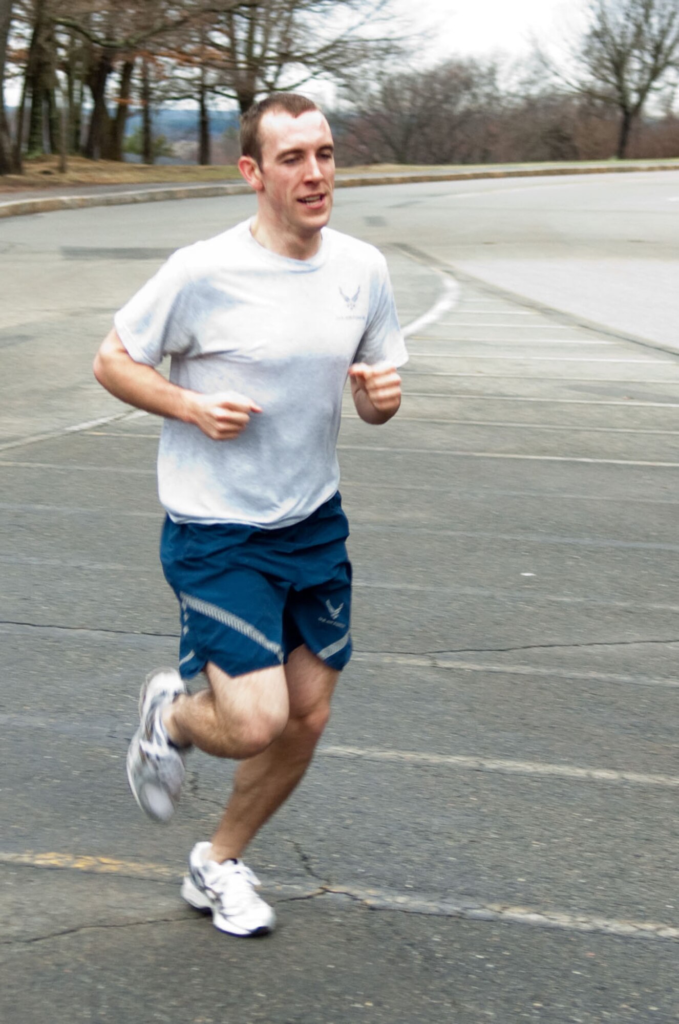 HANSCOM AIR FORCE BASE, Mass. - Taking first place in the male category, 2nd Lt. Ron Jenkins runs during the Air Force Assistance Fund 5K Fun Run. Lieutenant Jenkins finished in 18 minutes and 51 seconds. The run, which took place on April 1, was an event open to all Hanscom personnel to raise awareness of the AFAF. (U.S. Air Force photo by Rick Berry)