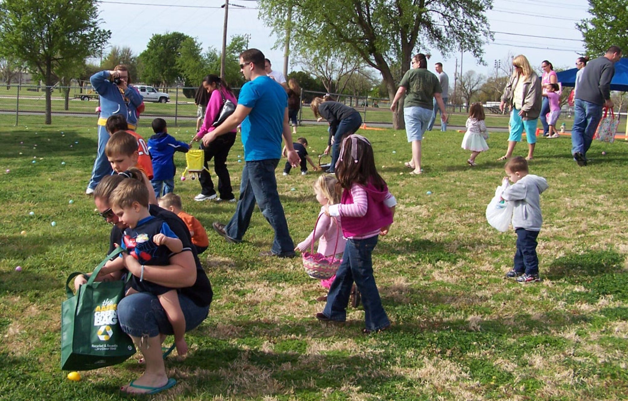 Children and parents from Sheppard Air Force Base make their way through the play yard at the Youth Center April 3 during the annual Easter Egg Hunt. About 150 people participated in this year's event. (Courtesy photo)