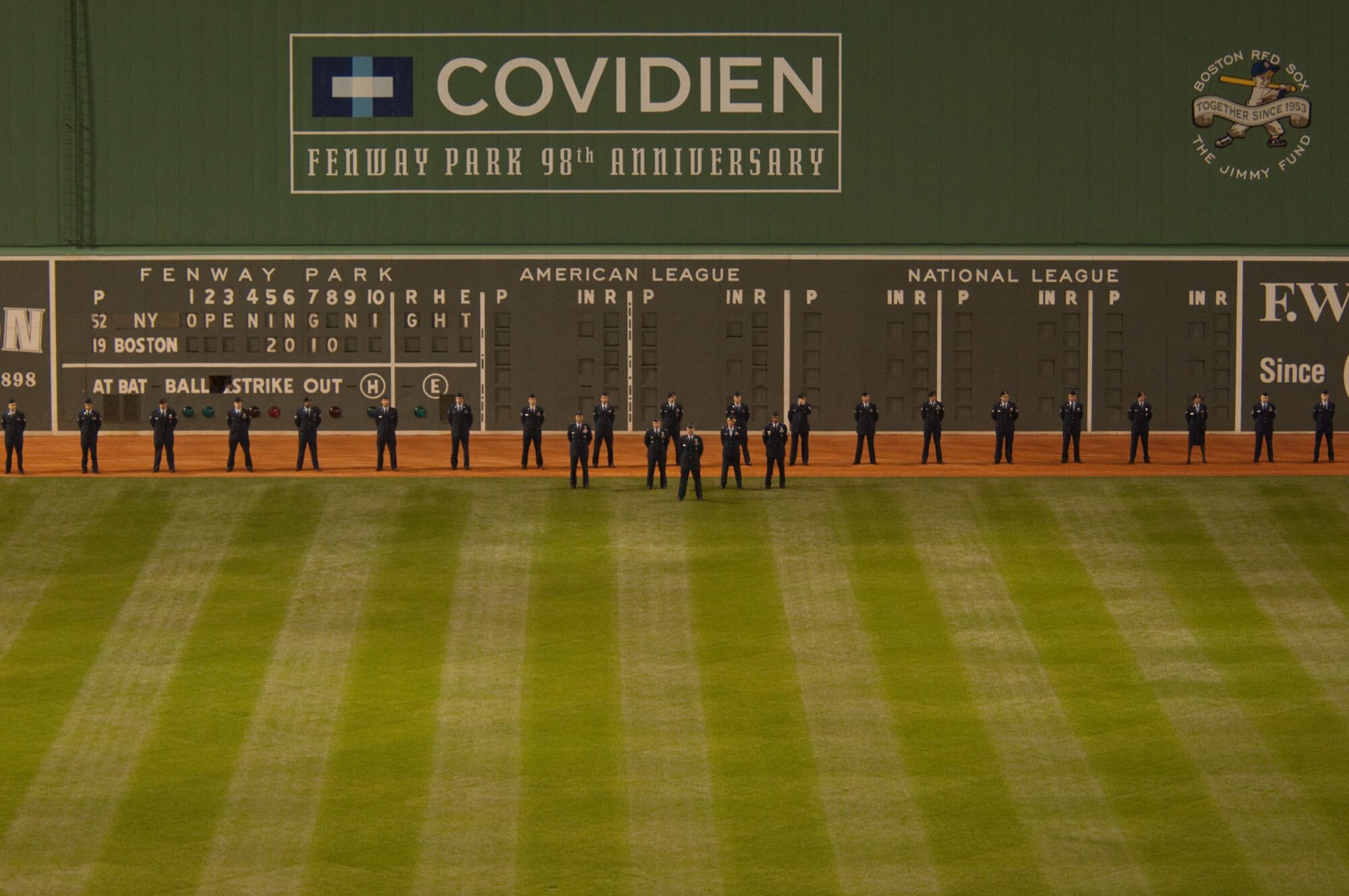 Just before the flag is dropped in front of the wall, Airmen line up to take part in opening day festivities at Fenway Park on April 4. (U.S. Air Force photo by Rick Berry)