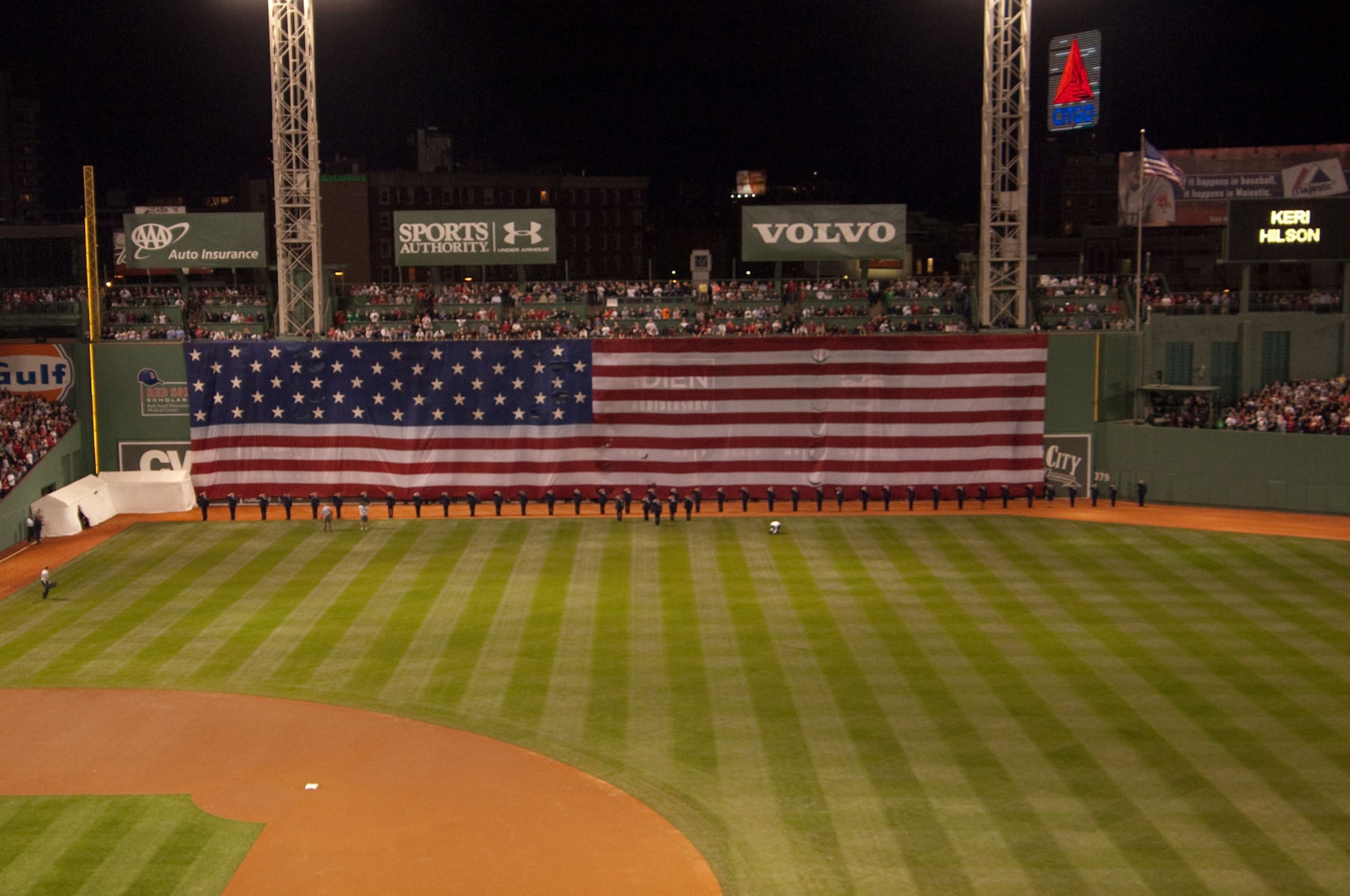 Airmen from Hanscom Air Force Base stand in front of the flag during opening day festivities at Fenway Park on April 4. (U.S. Air Force photo by Rick Berry)