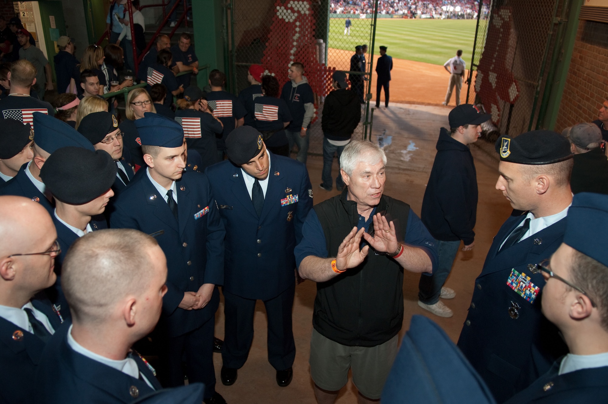 Airmen from Hanscom Air Force Base receive instructions before walking on the field to take part in opening day festivities at Fenway Park on April 4. (U.S. Air Force photo by Rick Berry)
