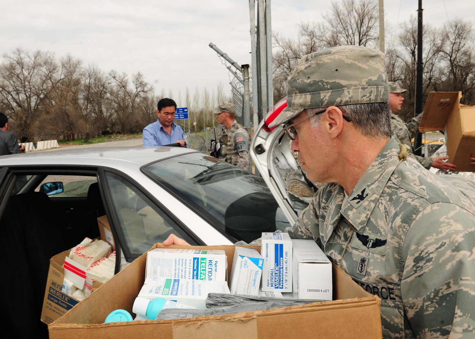 The 376th Expeditionary Medical Group personnel, at the Transit Center at Manas, Kyrgyzstan, deliver needed medical supplies April 8, 2010 to personnel from the National Surgical Center and the National Center of Traumatology and Orthopedics. The 376th EMDG was able to gather the humanitarian aid supplies and distribute them in a little over an hour after the request for supplies was made. The medical supplies include dressing, gauze, adhesive tape, sutures, disinfectant, antibiotics, antiseptics and IV solution. (U.S. Air Force photo/Senior Airman Nichelle Anderson/released)
