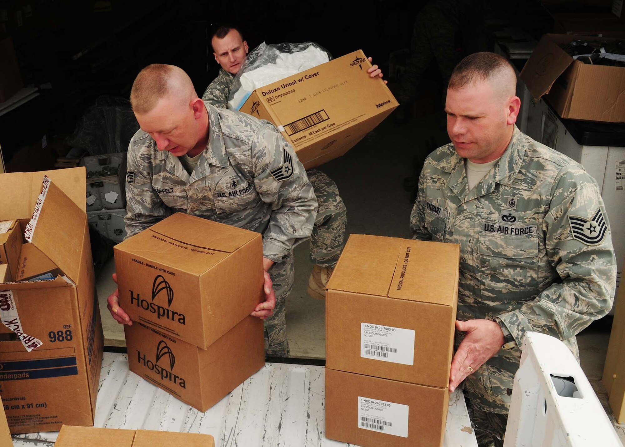 The 376th Expeditionary Medical Group personnel, at the Transit Center at Manas, Kyrgyzstan, deliver needed medical supplies April 8, 2010 to personnel from the National Surgical Center and the National Center of Traumatology and Orthopedics. The 376th EMDG was able to gather the humanitarian aid supplies and distribute them in a little over an hour after the request for supplies was made. The medical supplies include dressing, gauze, adhesive tape, sutures, disinfectant, antibiotics, antiseptics and IV solution. (U.S. Air Force photo/Senior Airman Nichelle Anderson/released)
