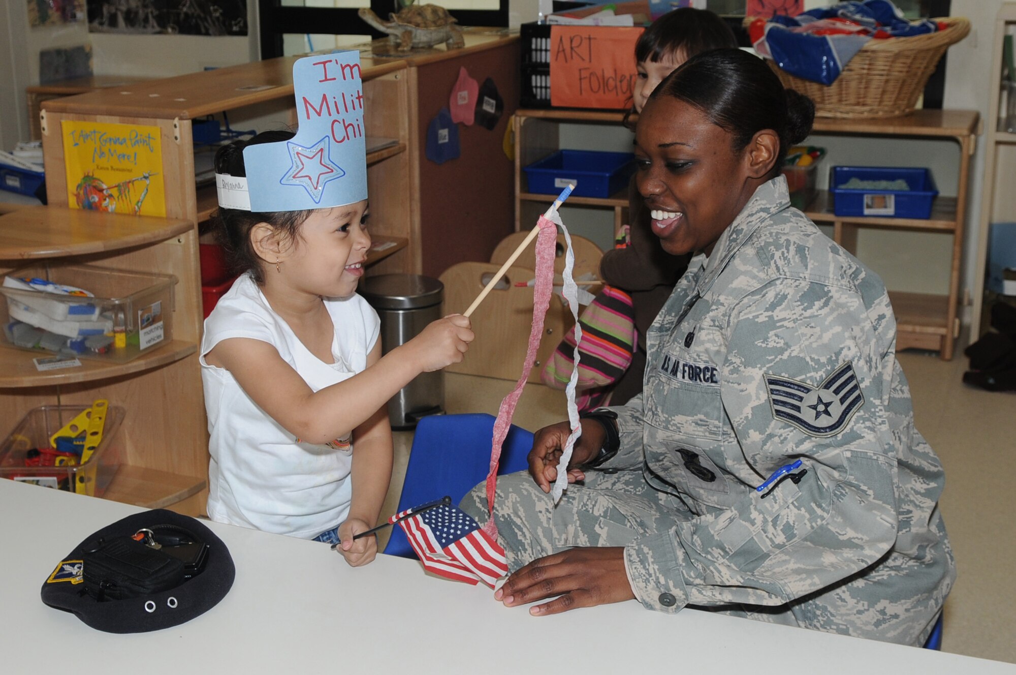 Staff Sgt. Barbara Case, 31st Security Forces Squadron, and her 3- year- old daughter, Bryanna Case, participate in the kickoff parade festivities at the Area F Child Development Center April 2. The month of April has been designated as Month of the Military Child as part of the Year of the Air Force Family.  
(U.S. Air Force photo/ Staff Sgt. MercedesKimble Crossland)