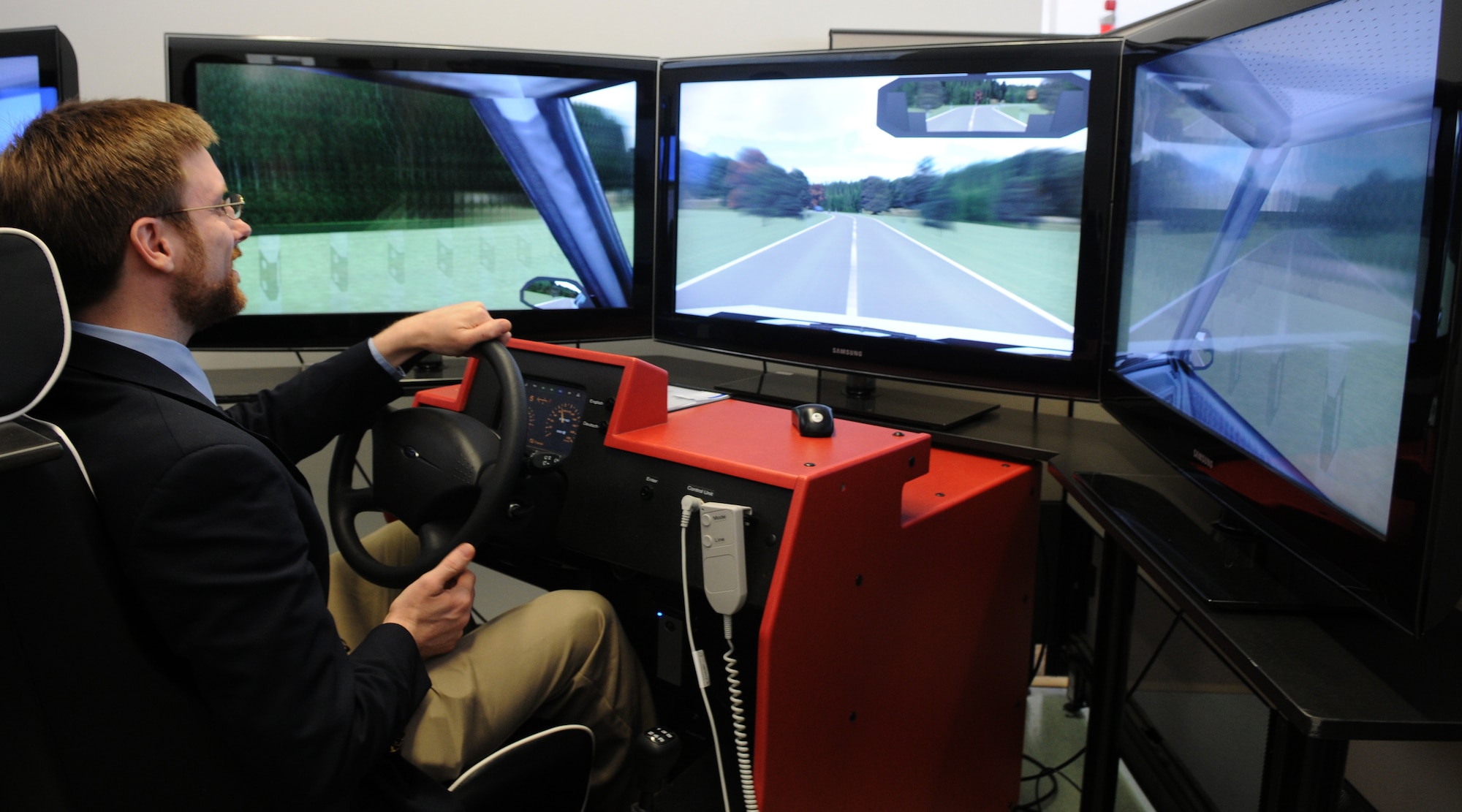 SPANGDAHLEM AIR BASE, Germany – Doctor of Philosophy, Jamie M. Morin, assistant secretary of the Air Force for Financial Management and Comptroller, uses the 52nd Fighter Wing’s driving simulator April 6. The virtual trainer is capable of simulating various weather conditions, terrain, time of day and the driver’s blood alcohol content. (U.S. Air Force photo/Airman 1st Class Staci Miller)