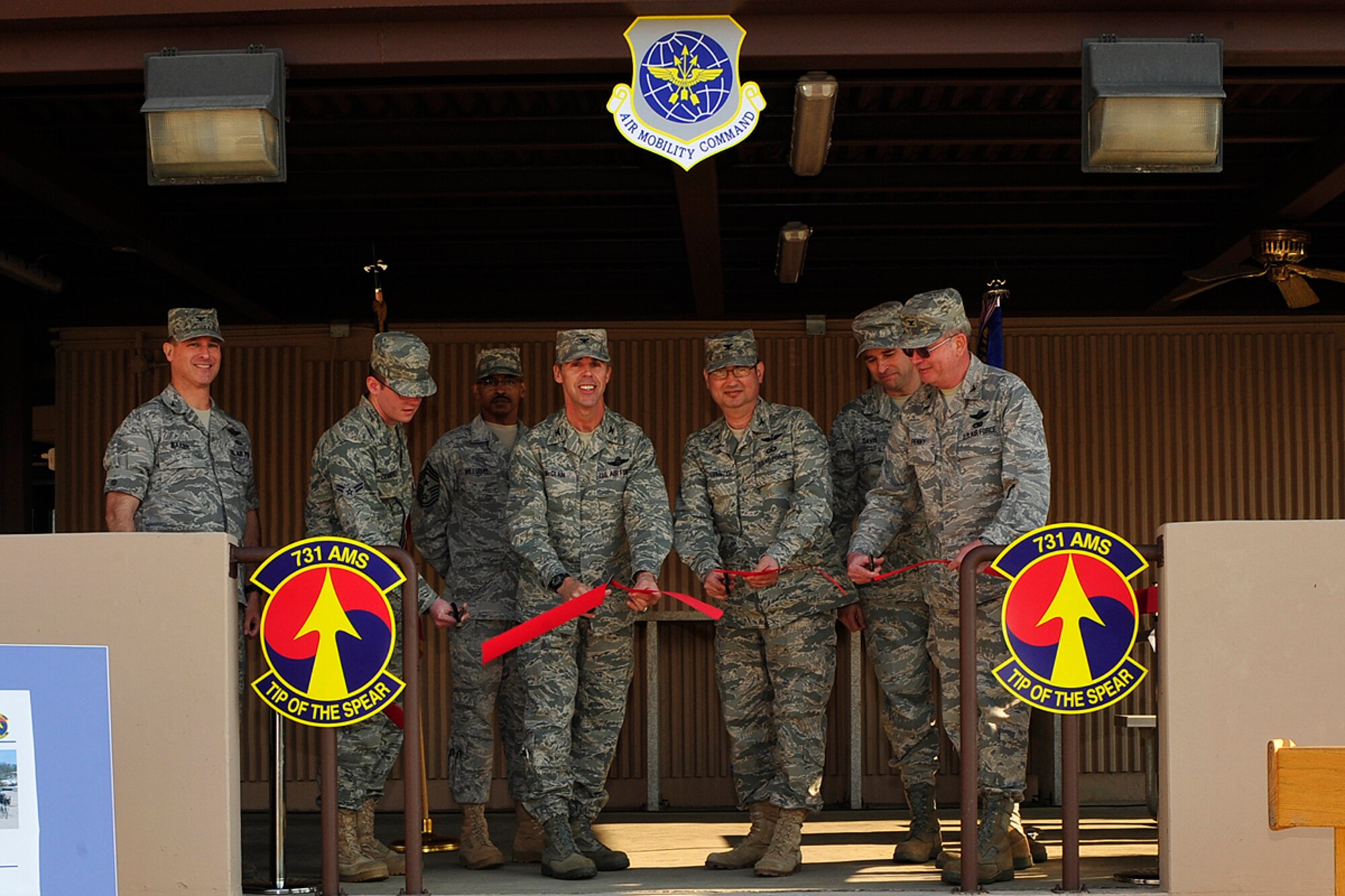 Col. Richard McClain, 515th Air Mobility Operations Wing commander, Col. Roland Van Deventer, 51st Mission Support Group commander, and Col. David Penny, 731st Air Mobility Squadron commander, perform the ribbon cutting for the newly renovated 731st AMS dormitory at Osan Air Base, Republic of Korea April 7. The dorm will serve as a consolidated living facility for 731st AMS and the Army 25th Transportation Battalion personnel and includes 119 rooms for enlisted personnel. (U.S. Air Force photo/Staff Sgt. Eunique Stevens)
