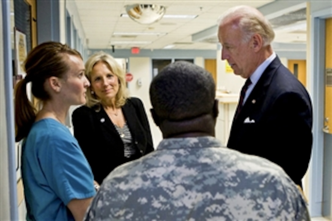 Vice President Joe Biden and Dr. Jill Biden talk to nursing student Alicia Pearl and Dr. Booker King before visiting a patient in the burn unit at Brooke Army Medical Center in San Antonio, April 7, 2010.