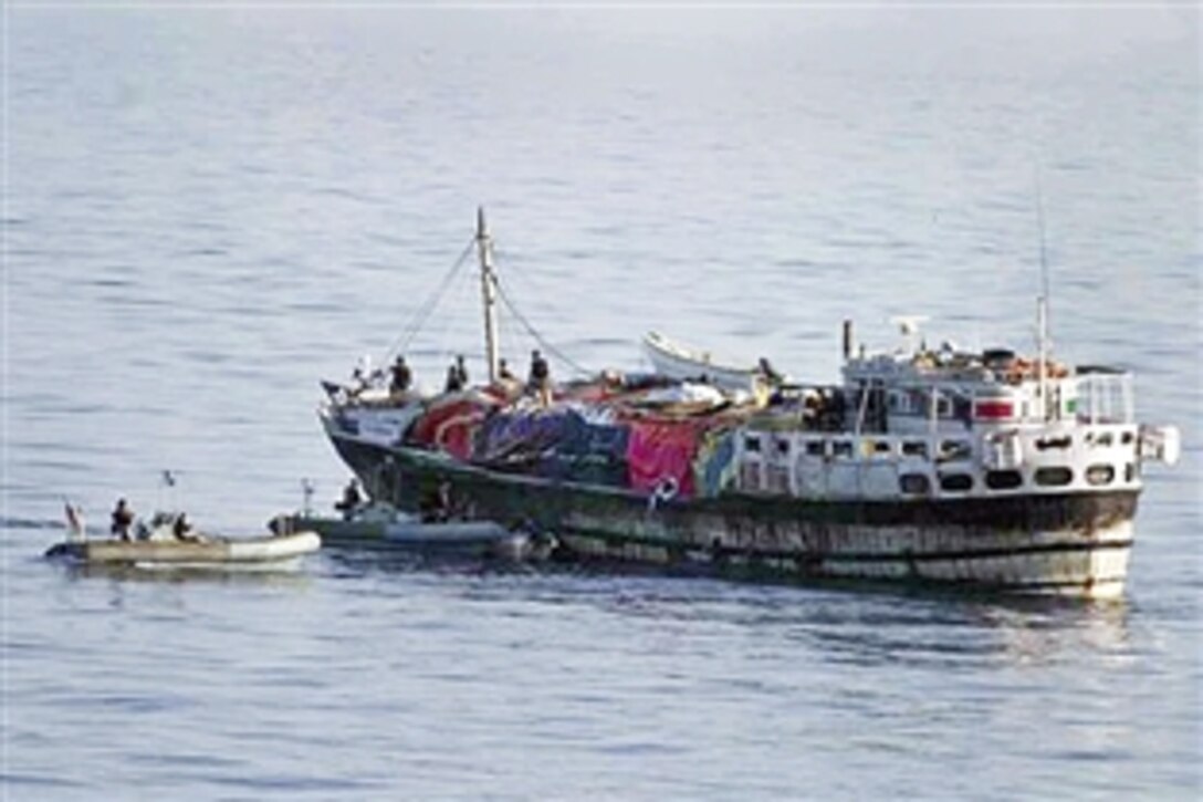 U.S. Navy members of a visit, board, search and seizure team from the guided-missile destroyer USS McFaul inspect the Indian-flagged vessel Faize Osamani in the Gulf of Oman, April 5, 2010. The sailors took 10 suspected pirates into custody and rescued eight crewmembers who had escaped from the dhow.