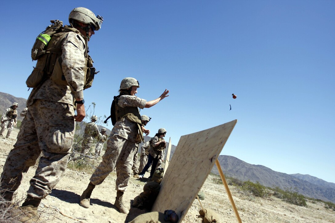 A 3rd Light Armored Reconnaissance Battalion spouse throws a dummy grenade April 9 during the battalion’s Jane Wayne Day at Combat Center Range 500. The day was meant to be a camaraderie-building experience between spouses.