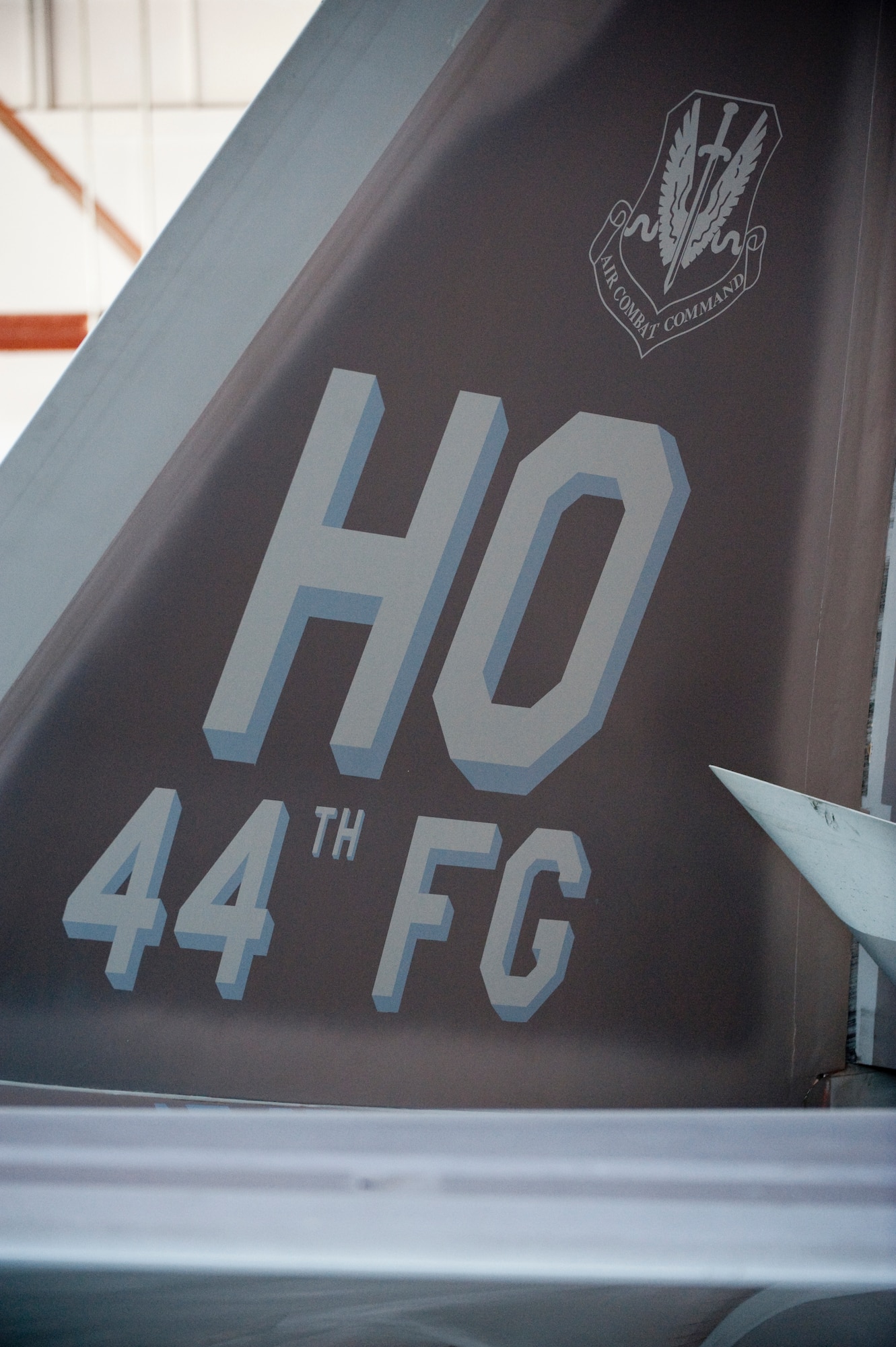 HOLLOMAN AIR FORCE BASE, N.M. -- The tail flash of an F-22 Raptor on display during the 44th Fighter Group activation ceremony April 9, 2010. The 44th Fighter Group traces its lineage to the famed World War II 44th Bombardment Group (Heavy) originally activated in January 1941 at MacDill Army Air Field in Tampa, Fla., and flew the then state-of-the-art B-24 Liberator. Sixty-nine years later, the 44th Fighter Group is the only Air Force Reserve organization to be selected to fly the U.S. Air Force's premier air superiority fighter, the F-22 Raptor. (U.S. Air Force photo by Staff Sgt. Joe Laws / Released)
