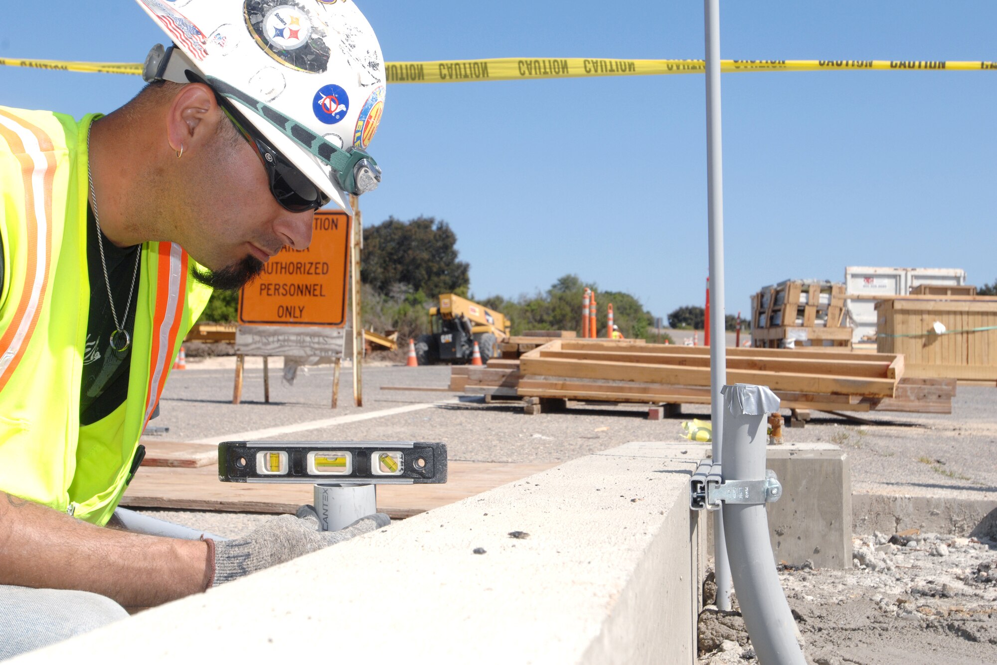 VANDENBERG AIR FORCE BASE, Calif. -- Joe Torres, an electrician of David Maurice Sherovani Electric, inspects work done on a trench during construction at the Lompoc Gate here Thursday, April 8, 2010. The construction will be completed in June 2010. (U.S. Air Force photo/Senior Airman Christopher Hubenthal)