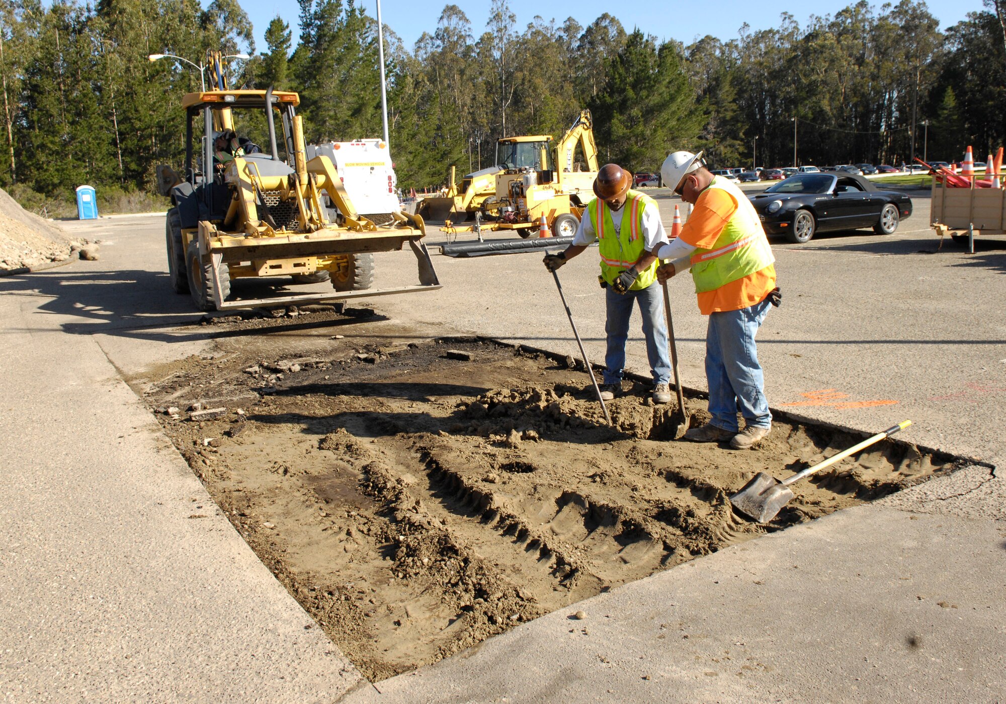 VANDENBERG AIR FORCE BASE, Calif.  – Contractors from Rockwood Construction lay out the design for the curve leading from the 30th Space Communications Squadron here Thursday, April 8, 2010. The newly paved driveway is a part of the beautification project for Building 12000, which also recently received a new coat of paint. (U.S. Air Force photo/Staff Sgt. Scottie T. McCord)