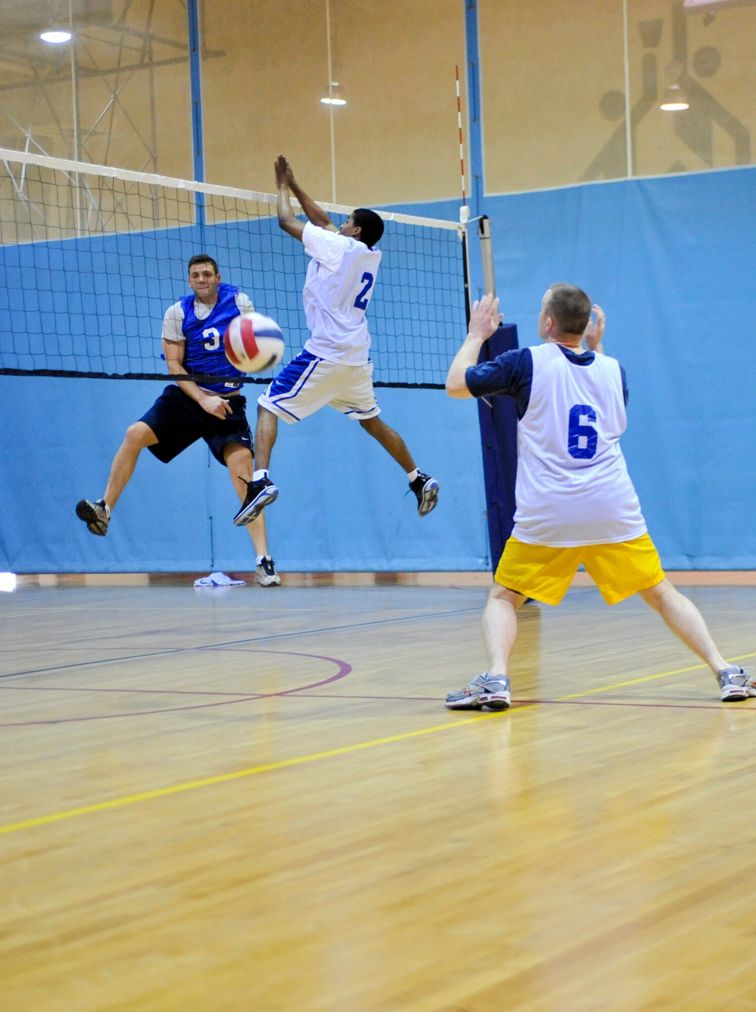 ELMENDORF AIR FORCE BASE, Alaska – A member of the 517th Airlift Squadron spikes the ball against the 3rd Wing Legal Office during a game of intramural volleyball April 8. The 517th AS mauled the 3rd WG JA taking two straight sets to win the game. (Air Force photo by Airman 1st Class Christopher Gross)