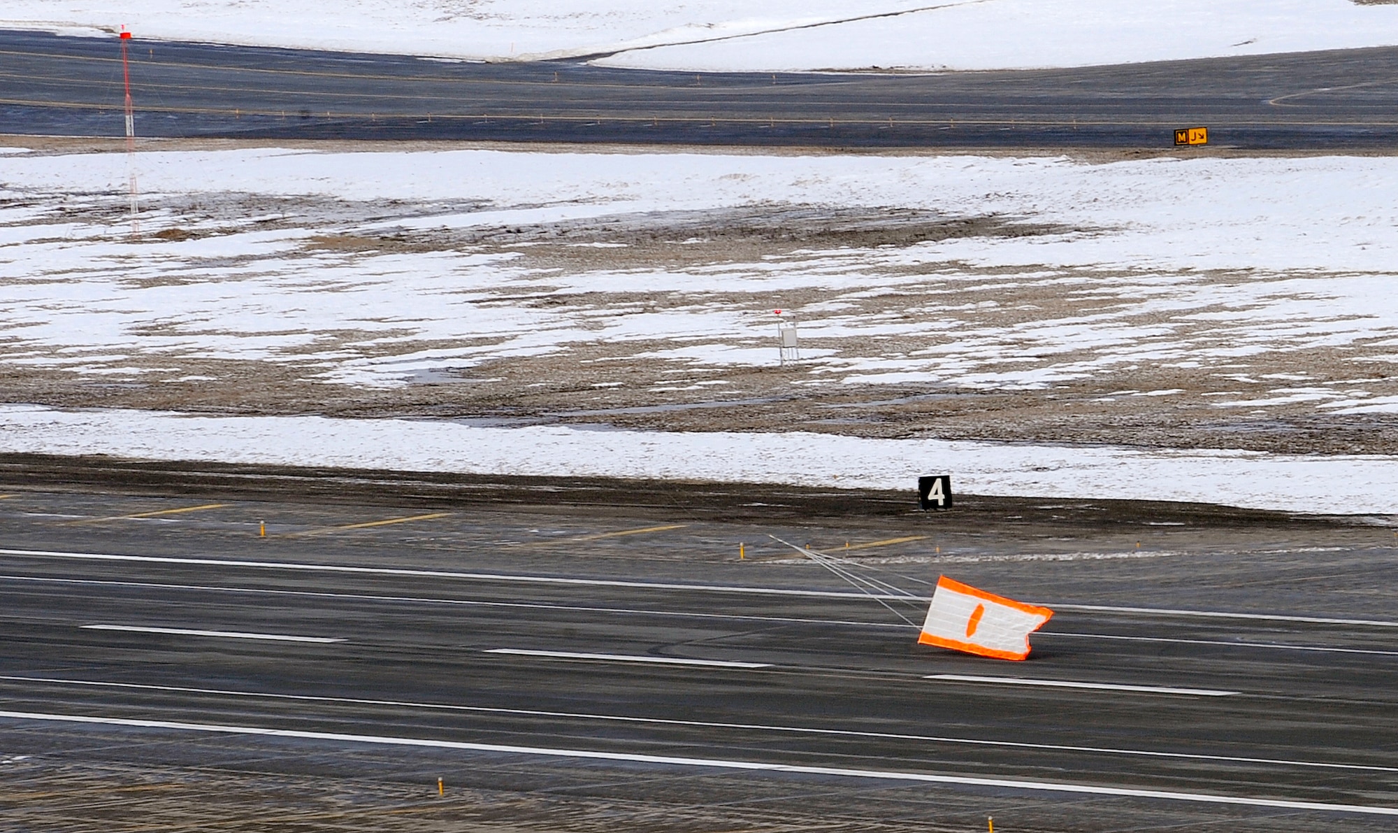 An air-to-air gunnery target banner lifts off the runway at Elmendorf Air Force Base, Alaska, prior to a live fire training mission over an Alaskan range, April 7. The air-to-air gun mission consisted of a Cessna Conquest towing an aerial banner 2,000 feet behind it while two F-15 Eagles took turns firing at the banner. The mission validated the 3rd Operations Group's air-to-air gunnery capability and was their first live fire gunnery mission here. (Air Force photo by Staff Sgt. Brian Ferguson)