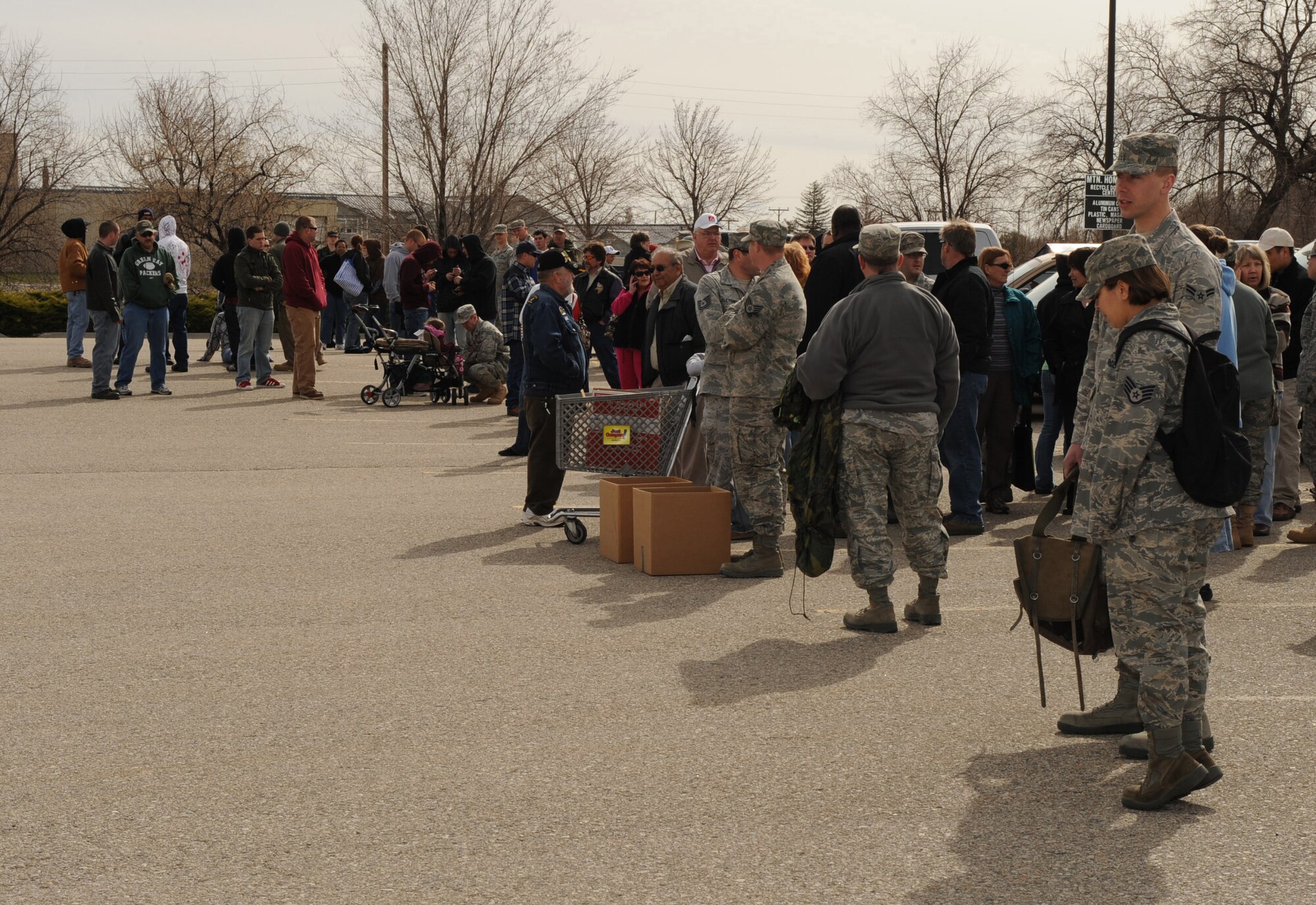 MOUNTAIN HOME AIR FORCE BASE, Idaho -- Airmen and their families wait outside the Base Exchange for a bag of free potatoes April 2. The event was sponsored by Snake River Produce Company, Ucon and Idaho Falls farmer Lt. Col. Tom Holm (Ret) of Sun Valley and his wife Beverly. The Sun Valley Charitable Foundation gave away 35,000 pounds of potatoes to military families at MHAFB. (U.S Air Force photo by Airman 1st Class Renishia Richardson)