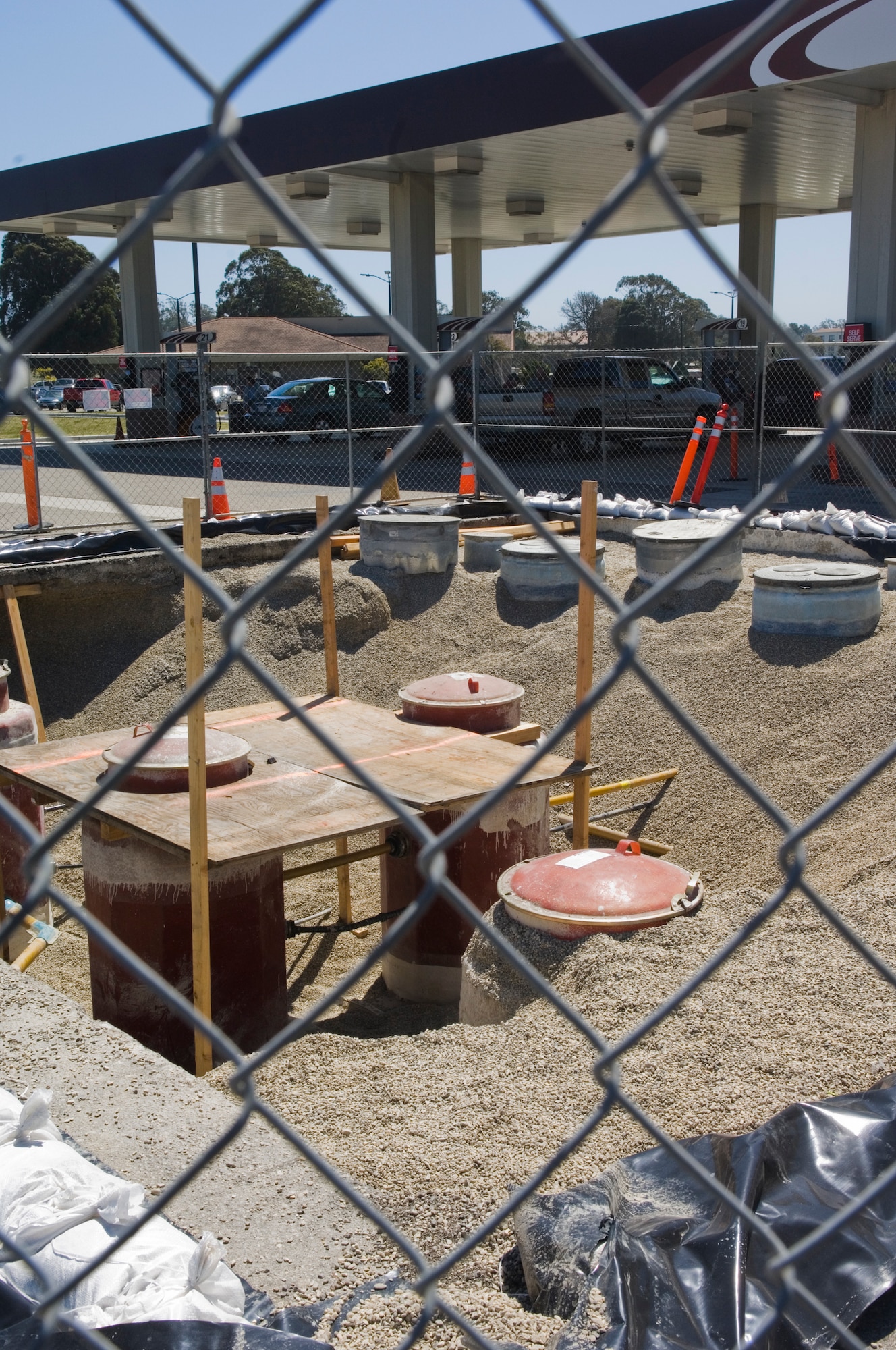 VANDENEBERG AIR FORCE BASE, Calif. – Sections of the Vandenberg Car Care Center are fenced off during construction here Thursday, April 8, 2010. The construction will upgrade the current gas pump storage tank. (U.S. Air Force photo/Staff Sgt. Levi Riendeau)