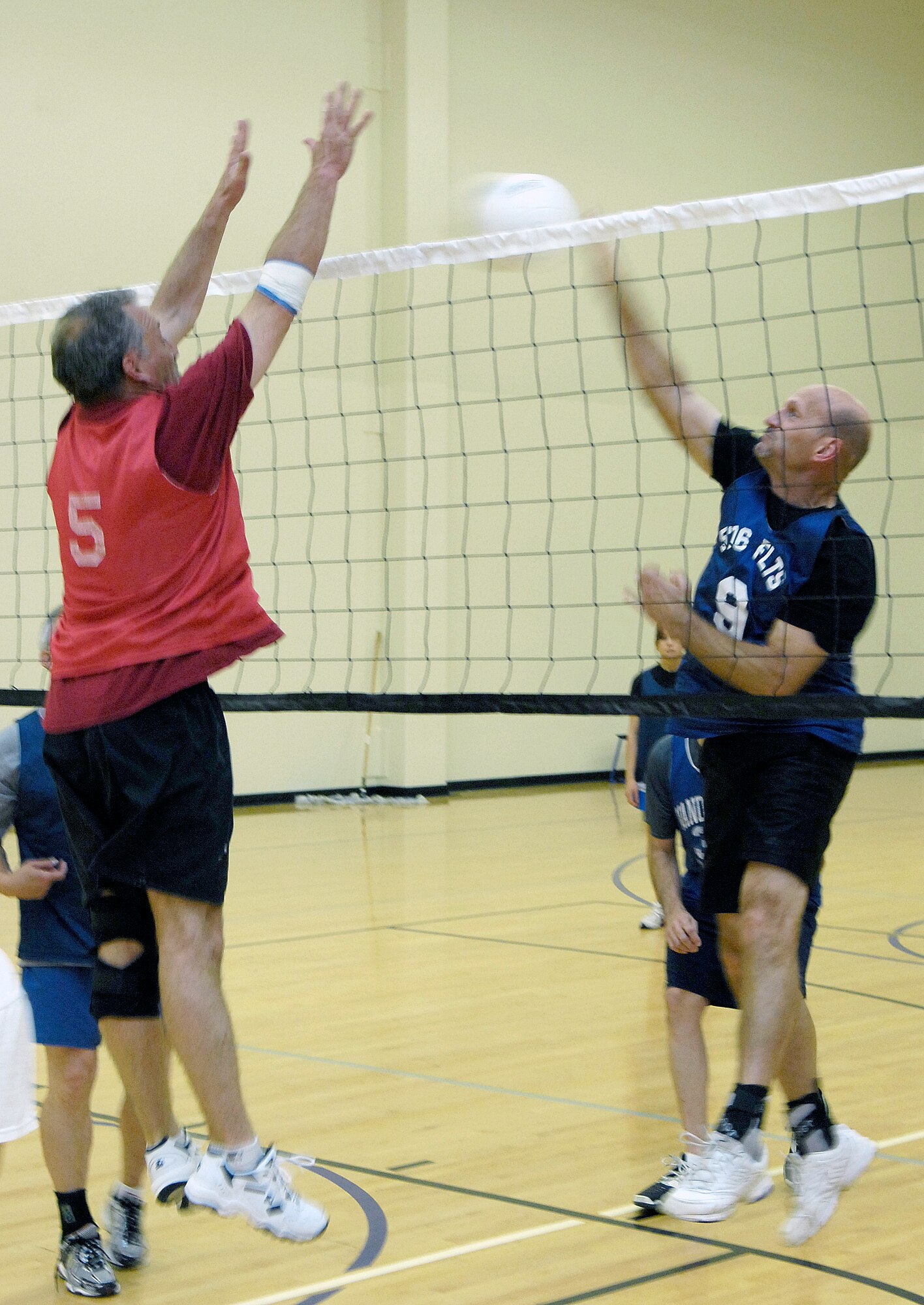 VANDENBERG AIR FORCE BASE, Calif. -- A player from the 30th Force Support Squadron/Mission Support Group team attempts to block a spike made by Jeff Willhite, from the 18th Intelligence Squadron team, during an intramural volleyball game here Wednesday, April 7, 2010. (U.S. Air Force photo/Airman 1st Class Andrew Lee) 
 
 