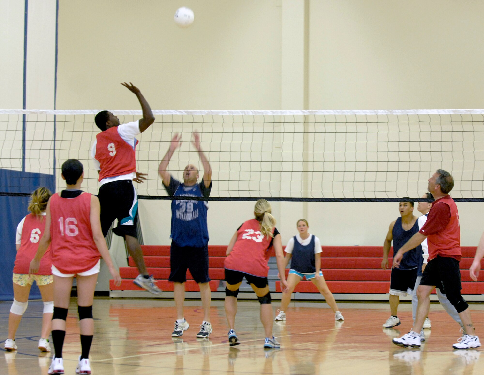 VANDENBERG AIR FORCE BASE, Calif. -- With spring-like hops, Dwayne Pritchett, from the 30th Force Support Squadron/Mission Support Group team, jumps high to spike the ball and score against the 18th Intelligence Squadron team during an intramural volleyball game here Wednesday, April 7, 2010.   (U.S. Air Force photo/Airman 1st Class Andrew Lee) 
 