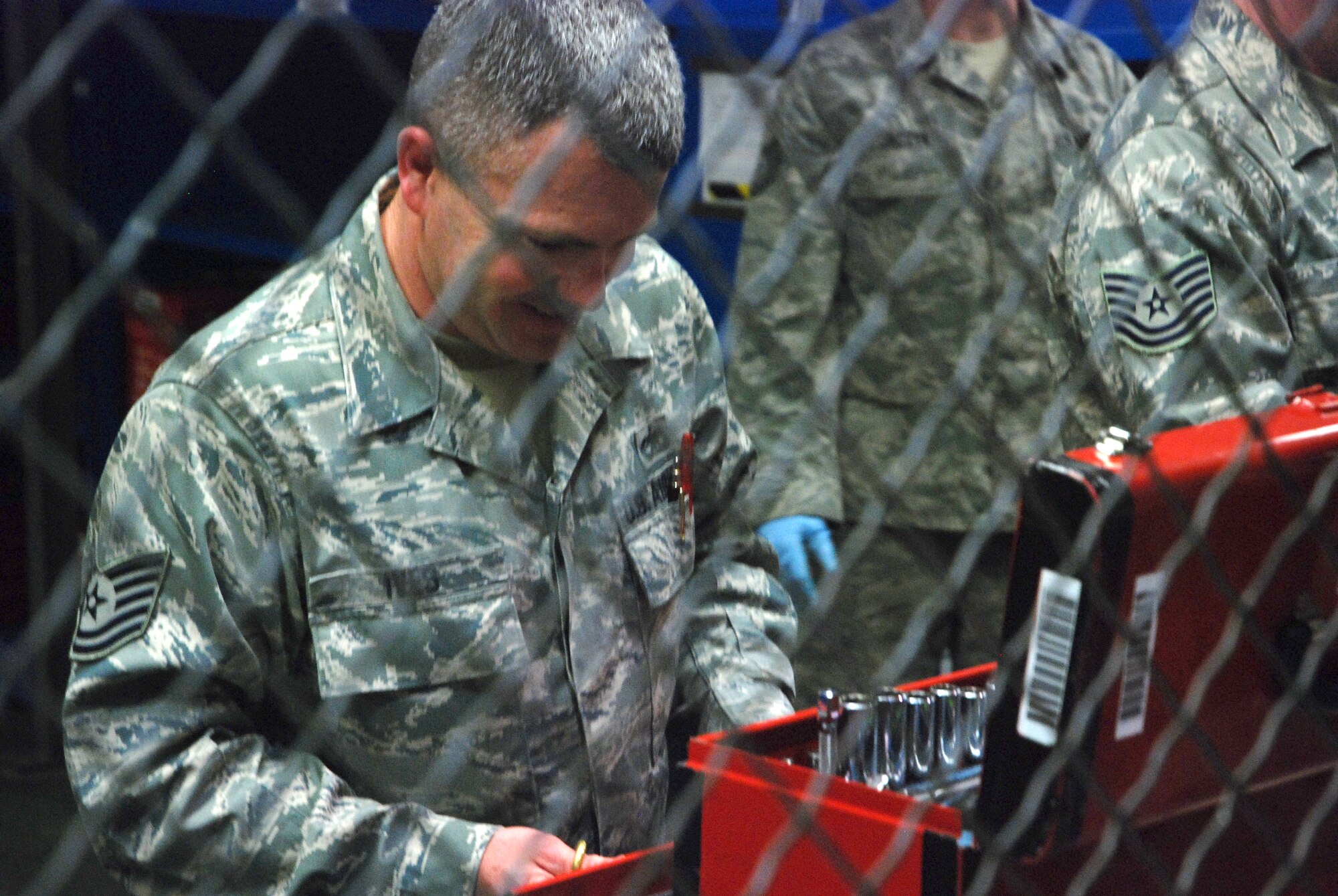 Technical Sgt. Brandon Ives, 439th Airlift Wing, Aircraft Maintenance Squadron, checks in and accounts for tools at the end of a late night shift.
